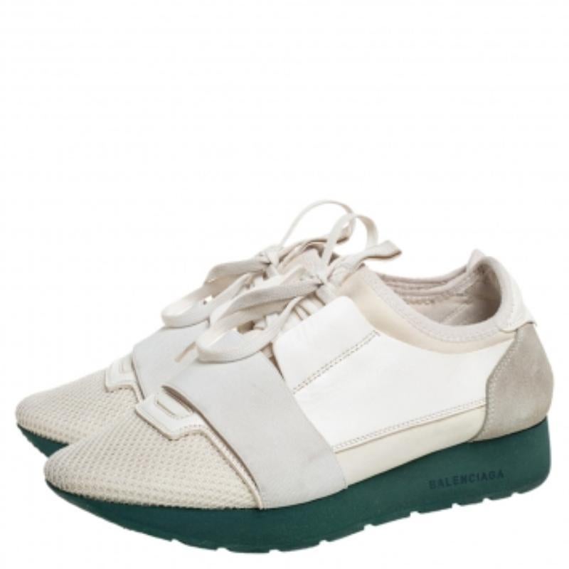 Let your latest shoe addition be this pair of Race Runners sneakers from Balenciaga. These white sneakers have been crafted from a blend of quality materials and feature a chic silhouette. They flaunt covered toes, strap detailing on the vamps, and