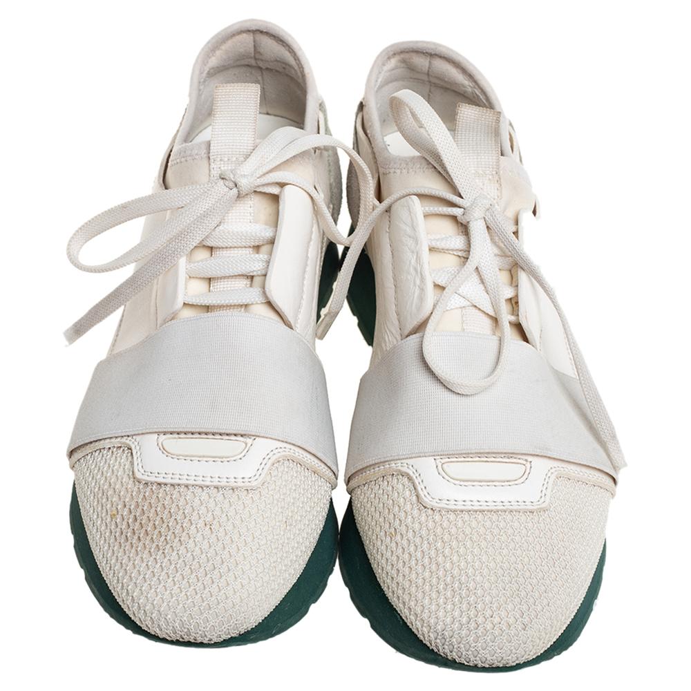 Let your latest shoe addition be this pair of Race Runners sneakers from Balenciaga. These white sneakers have been crafted from a blend of quality materials and feature a chic silhouette. They flaunt covered toes, strap detailing on the vamps, and
