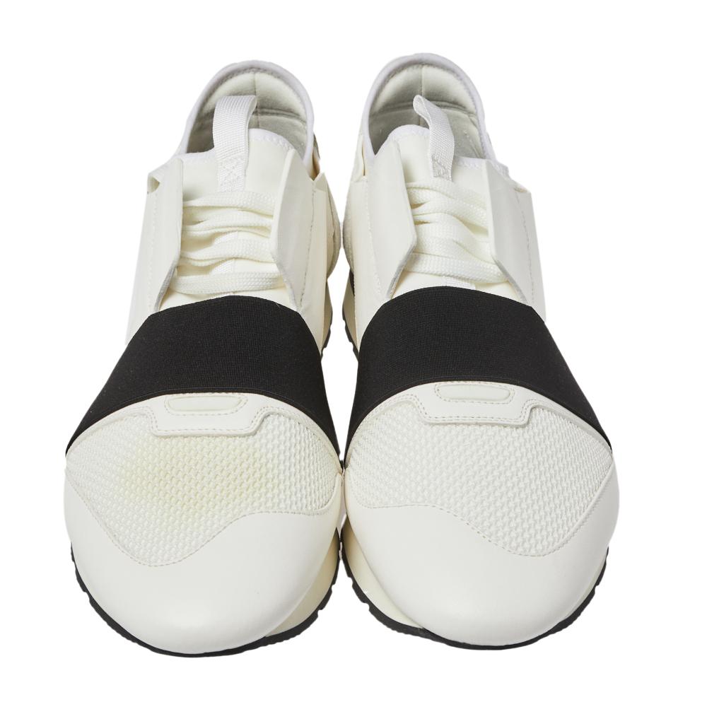 Let your latest shoe addition be this pair of Race Runners sneakers from Balenciaga. These white sneakers have been crafted from suede, leather, and mesh and feature a chic silhouette. They flaunt covered toes, strap detailing on the vamps, and