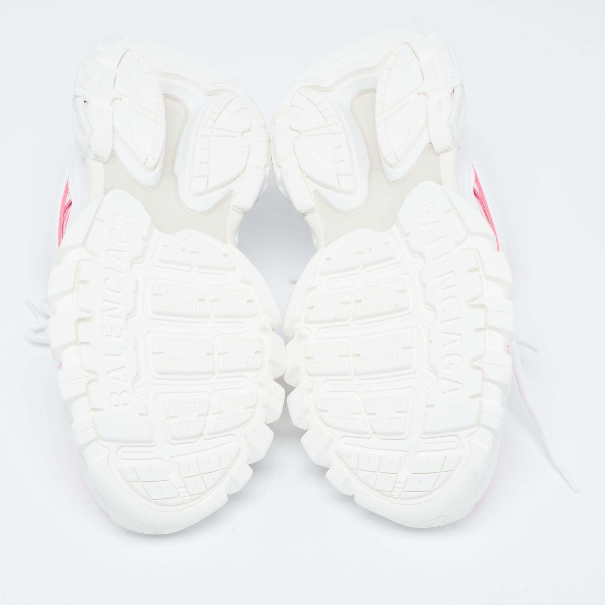 The Balenciaga Track Sneakers seamlessly blend style and comfort. Crafted with precision, these sneakers feature a sleek white rubber sole and a breathable knit fabric upper with delightful pink accents, creating a modern footwear masterpiece that