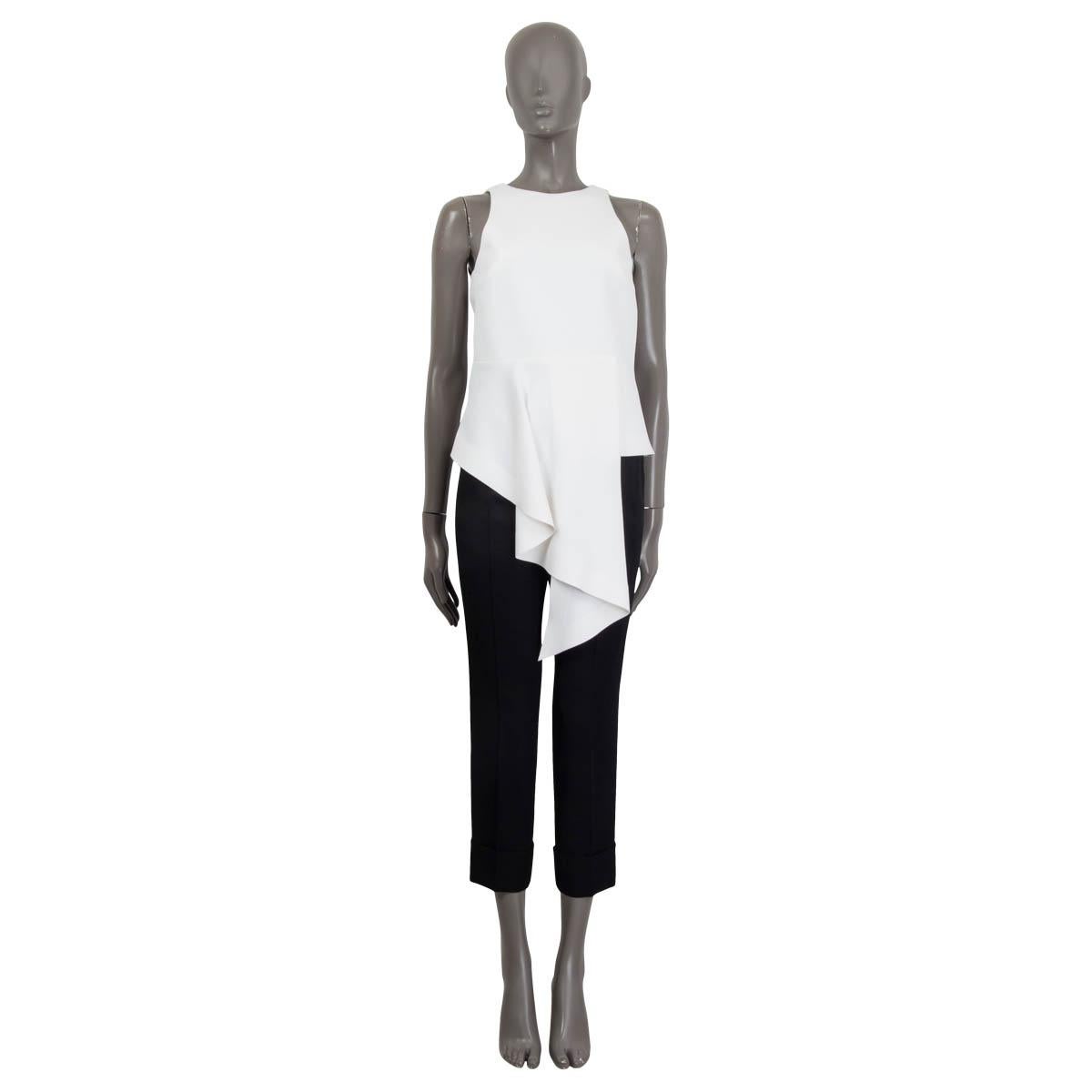 100% authentic Balenciaga sleeveless asymmetrical top in white polyester (90%) and elastane (10%). Opens with a hook and a zipper at the back. Semi-lined in white acetate (72%) and silk (28%). Has been worn and is in excellent condition.