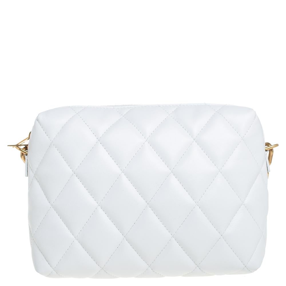 Designed to last, this beautiful bag from Balenciaga will make a prized buy. Comfortable and easy to carry, this quilted leather creation comes in white with the brand initial on the front. It has a shoulder strap and an interior lined with leather