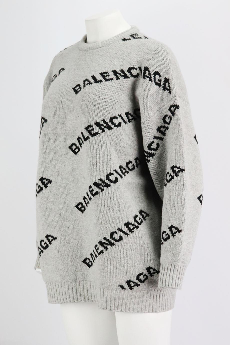 This sweater by Balenciaga is made from jacquard-knit with its unmistakable repeating moniker, it's spun from soft wool-blend in an oversized fit, so it layers easily over tees and sweaters alike. Grey and black wool-blend. Slips on. 49% Wool, 48%