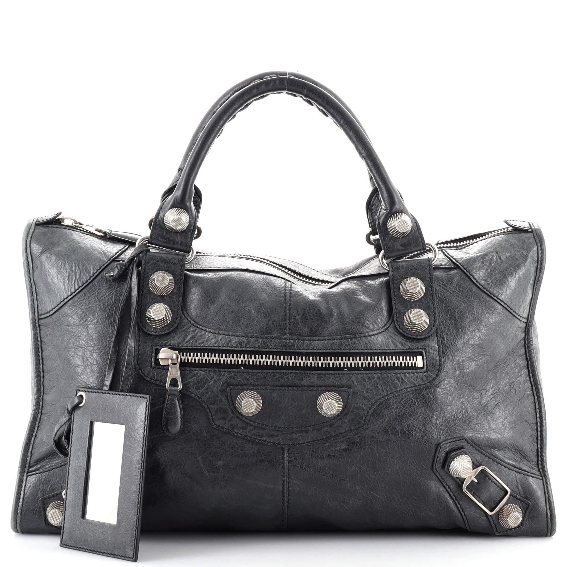 Condition: Good. Creasing on exterior, heavy wear along exterior edges, wear and darkening handles. Splitting on handle wax edges, nicks on rear handle, pilling on zipper tape. Wear in interior, scratches on hardware.
Accessories: