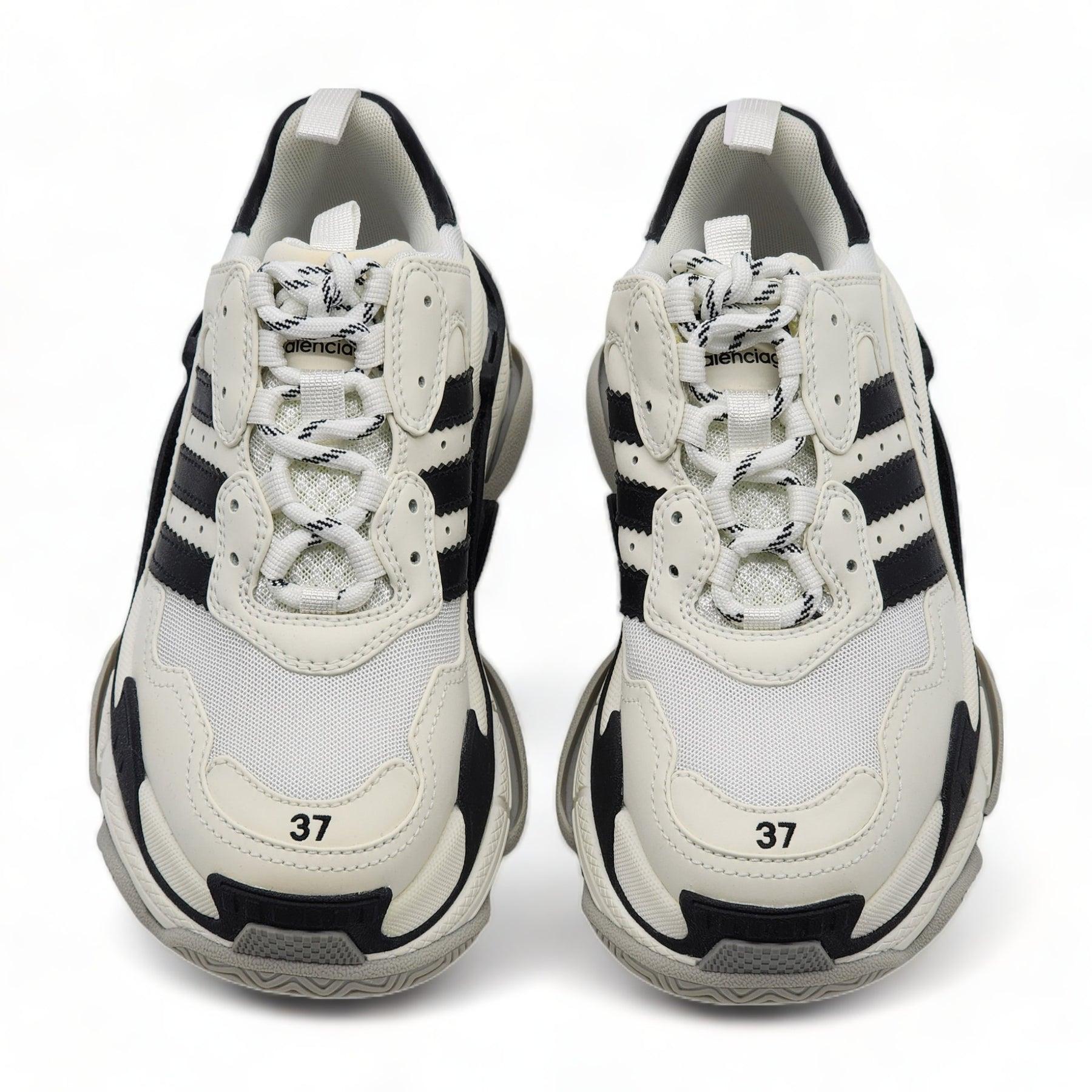 Balenciaga x adidas Triple S sneakers (W).

Mesh detailing, Logo print to the side, Embroidered design, Logo-print tongue, Branded heel counter, Pull-tab at the heel, Round toe, front lace-up fastening, chunky rubber sole.

Additional