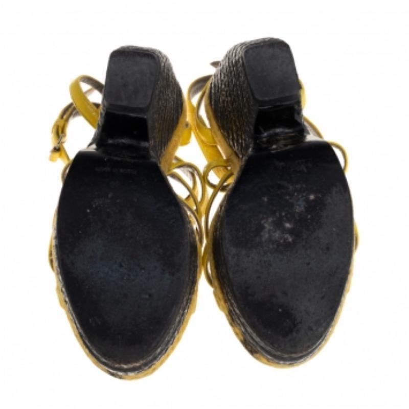 These Balenciaga yellow sandals in beautiful leather are full of style. In an open-toe silhouette with ankle strap closure, this pair is easy to slip on and off. The 13 cm wedge heels lend a contemporary edge.