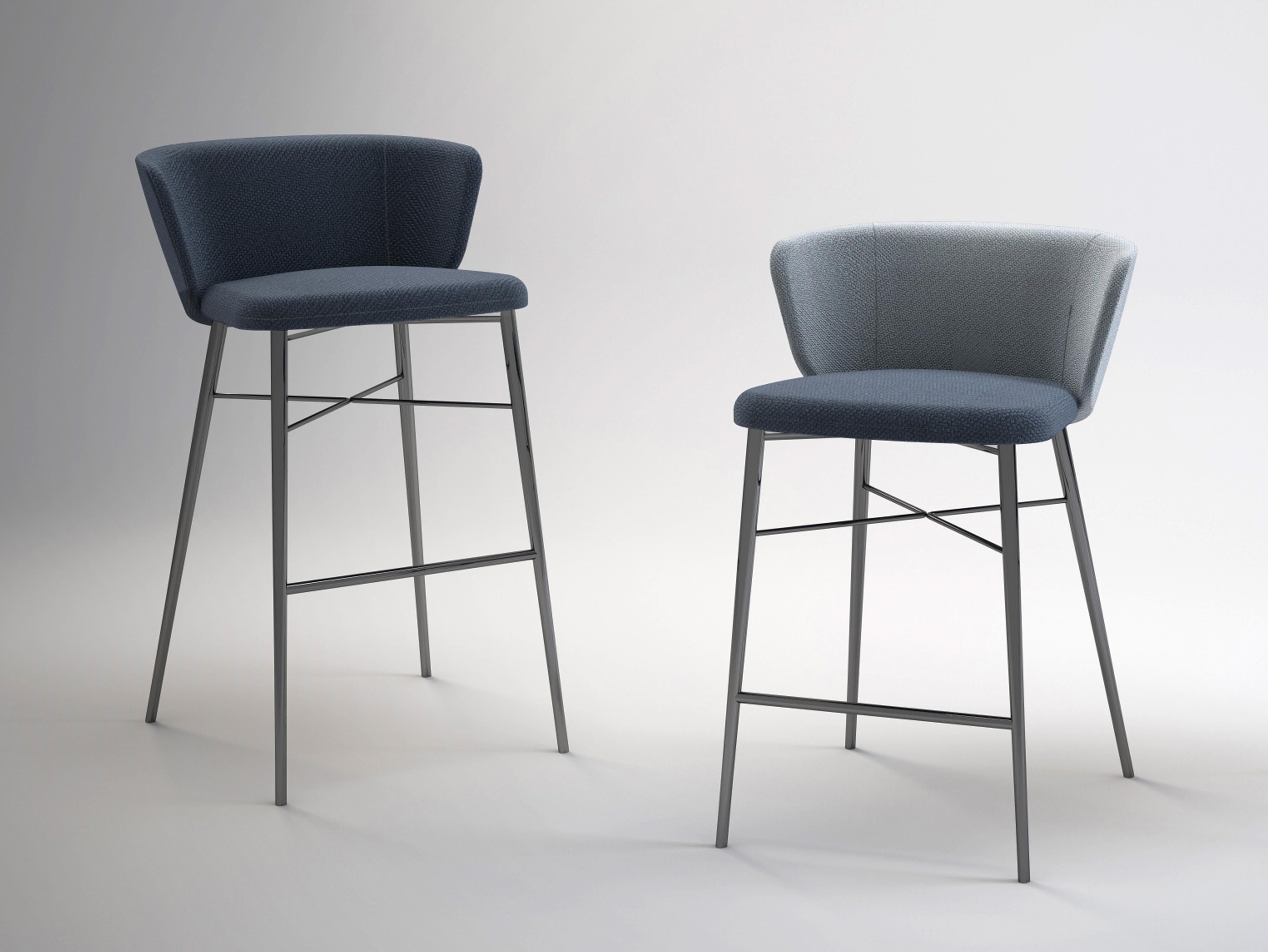 Available in a range of colors and fabric options, the Kin padded bar stools have a structure made of steel tubes finished in a light grey or anthracite grey epoxy powder coat or black chrome. 
Flexible polyurethane backrest, processed without CFC.