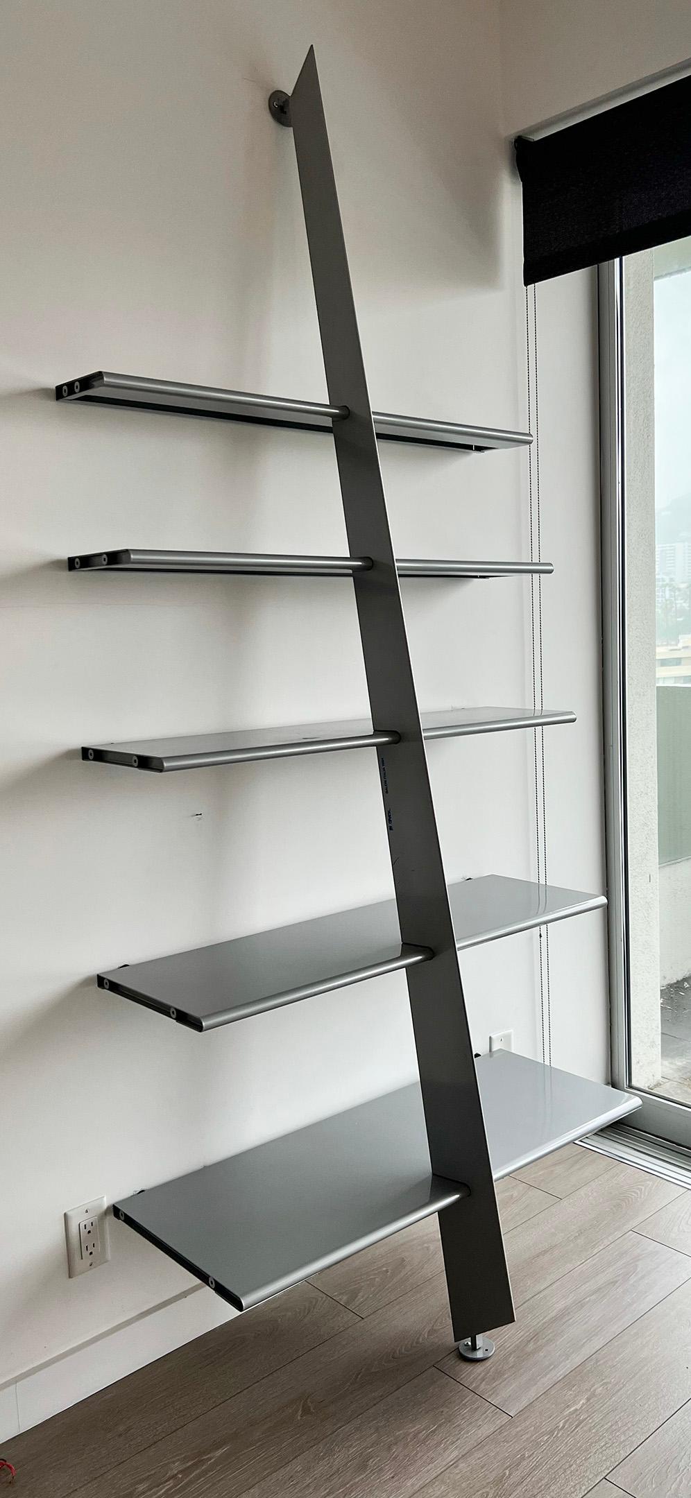 Behold, the epitome of avant-garde sophistication: the Philippe Starck Mc Gee shelving unit born in 1984 for Baleri Italia. A symphony of form and function, this shelving unit is not merely a piece of furniture; it's a statement, an expression of