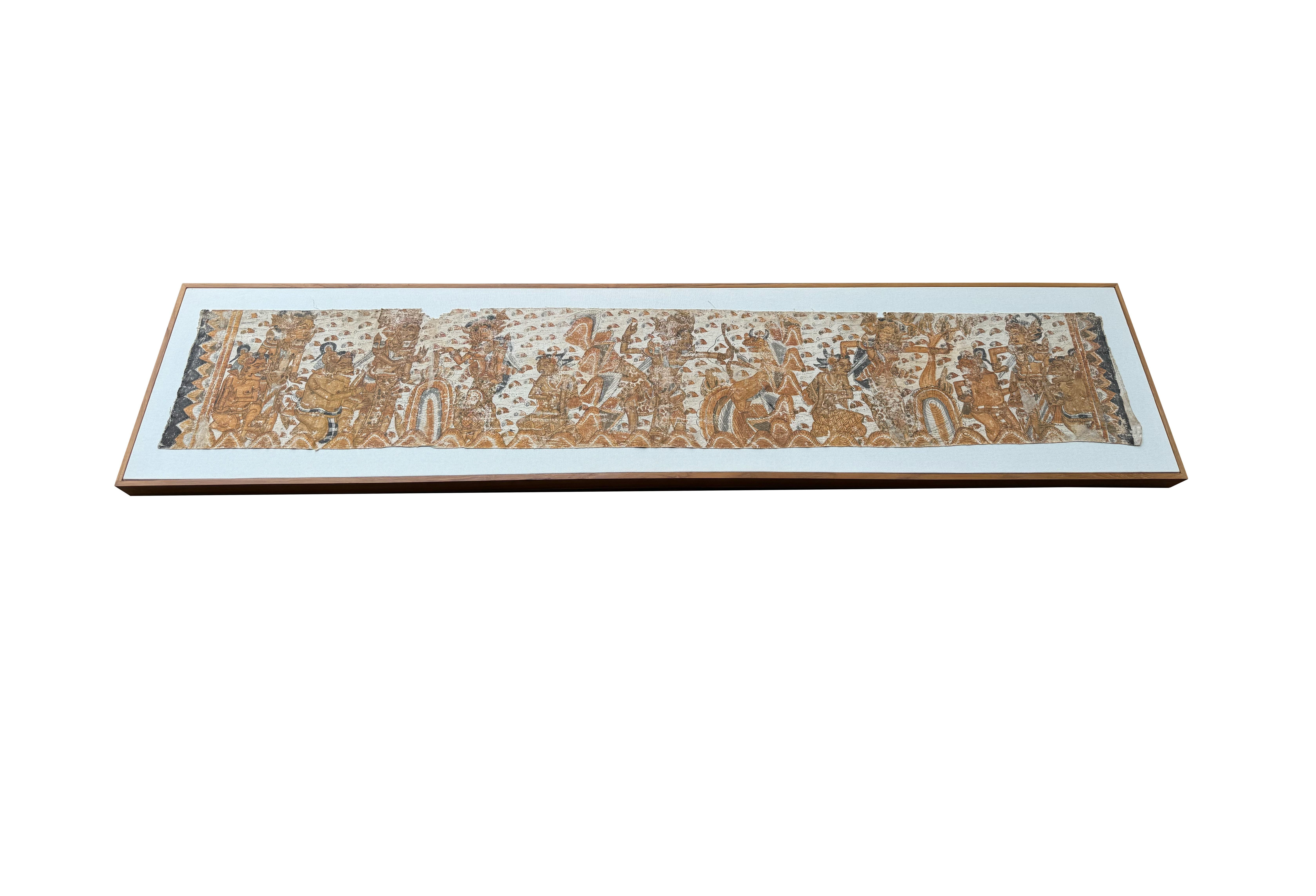 Esta llamativa pintura balinesa Kamasan vintage, realizada sobre algodón tejido a mano, capta maravillosamente la elegancia atemporal de la narración clásica al estilo Wayang. Con intrincadas escenas de epopeyas hindúes y del folclore javanés, la