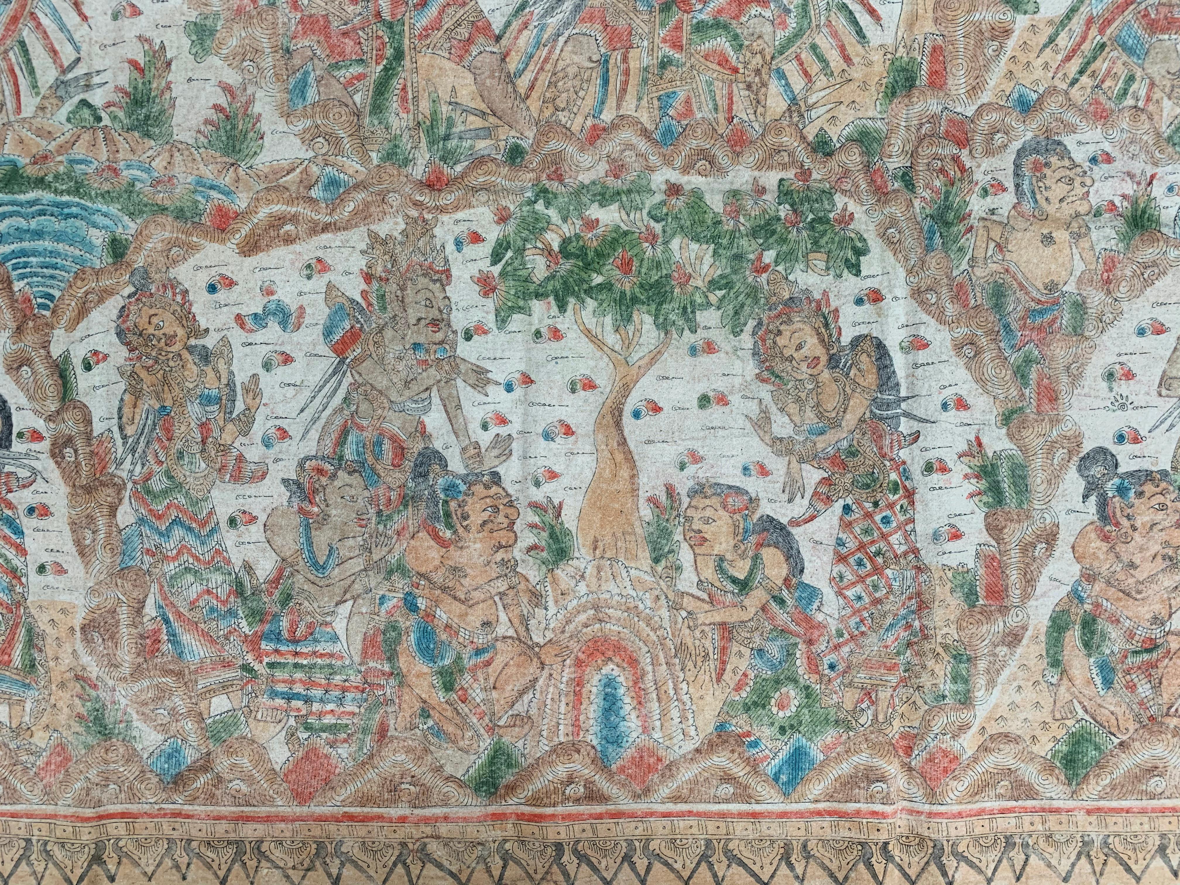 An early 20th century 'Kamasan' cotton textile painting from Bali, Indonesia. The hand-painted image has great detail and depicts Balinese Hindu mythology. 

Dimensions: Height 84cm x width 182cm.