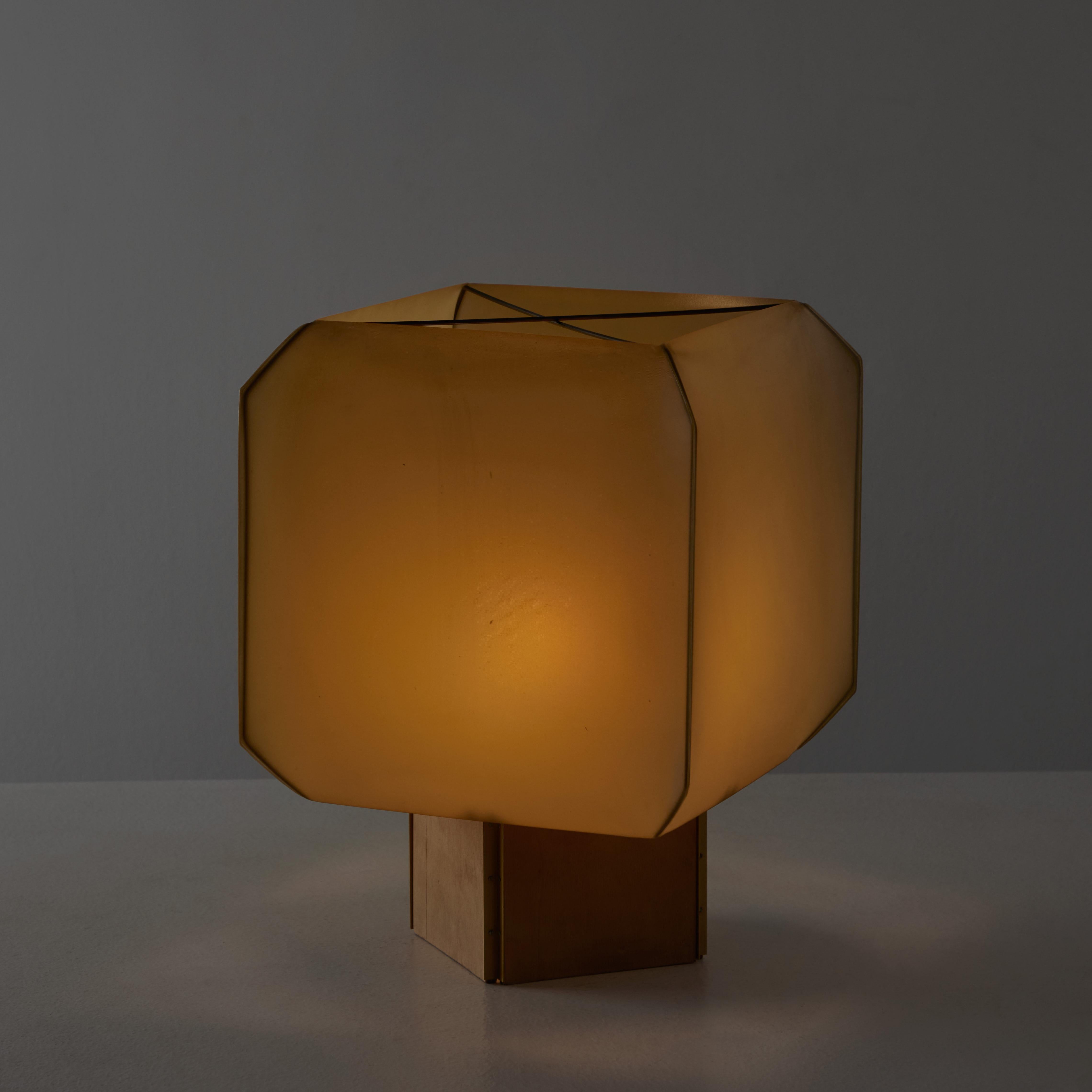 Bali table lamp by Bruno Munari for Danese. Designed and manufactured in Italy, 1958. Resin fabric shade and wooden base. Original cord with on/off switch. Holds a single E27 socket, adapted for the US. We recommend one 40w maximum bulb. Bulb
