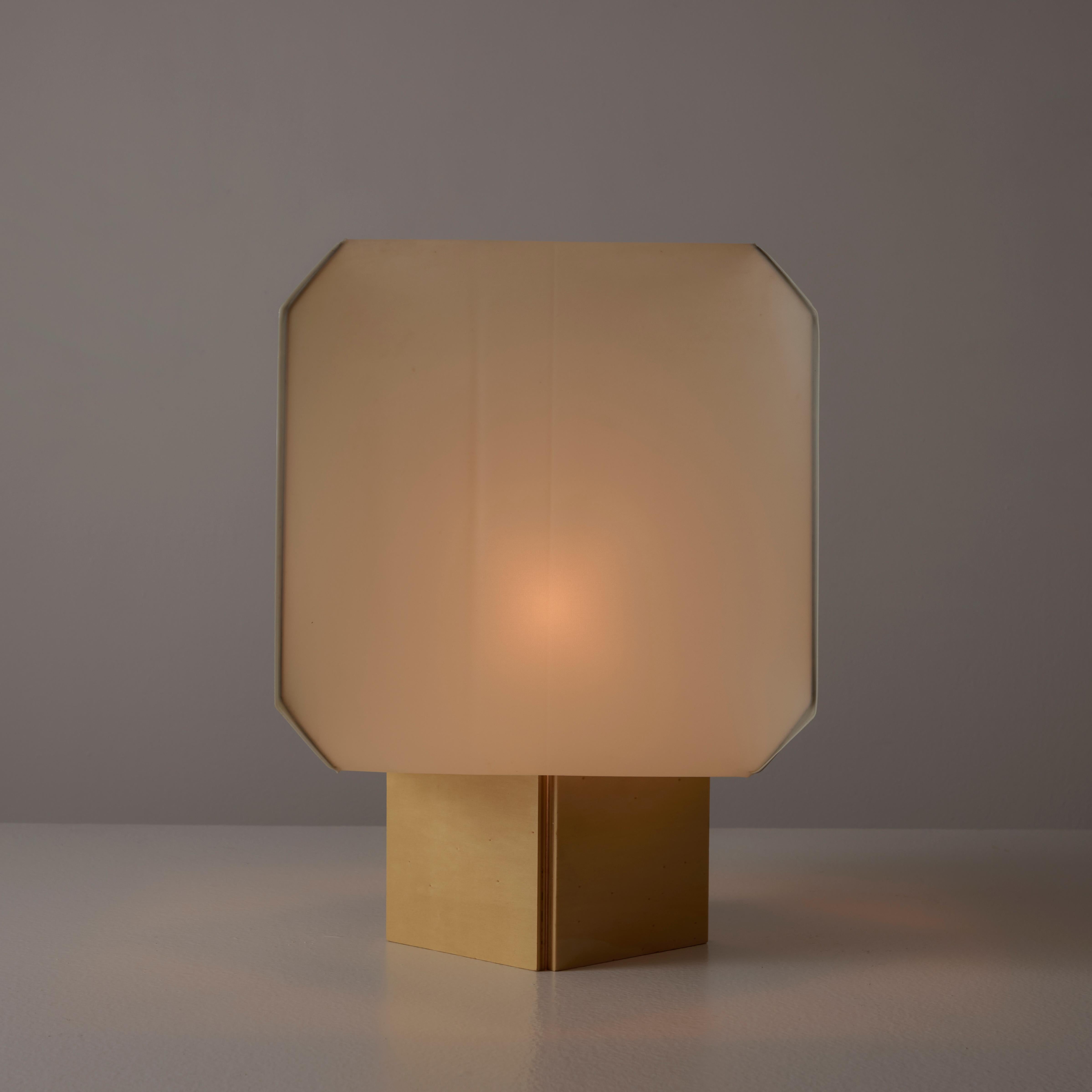 Bali table lamp by Bruno Munari for Danese. Designed and manufactured in Italy, in 1958. Resin fabric shade and wooden base. Original cord with on/off switch. Holds a single E27 socket, adapted for the US. We recommend one 40w maximum bulb. Bulbs