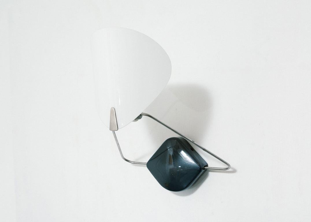 Postmodern wall sconce with frosted milk glass shade and adjustable arm. Metallic steel gray finish on wall plate.