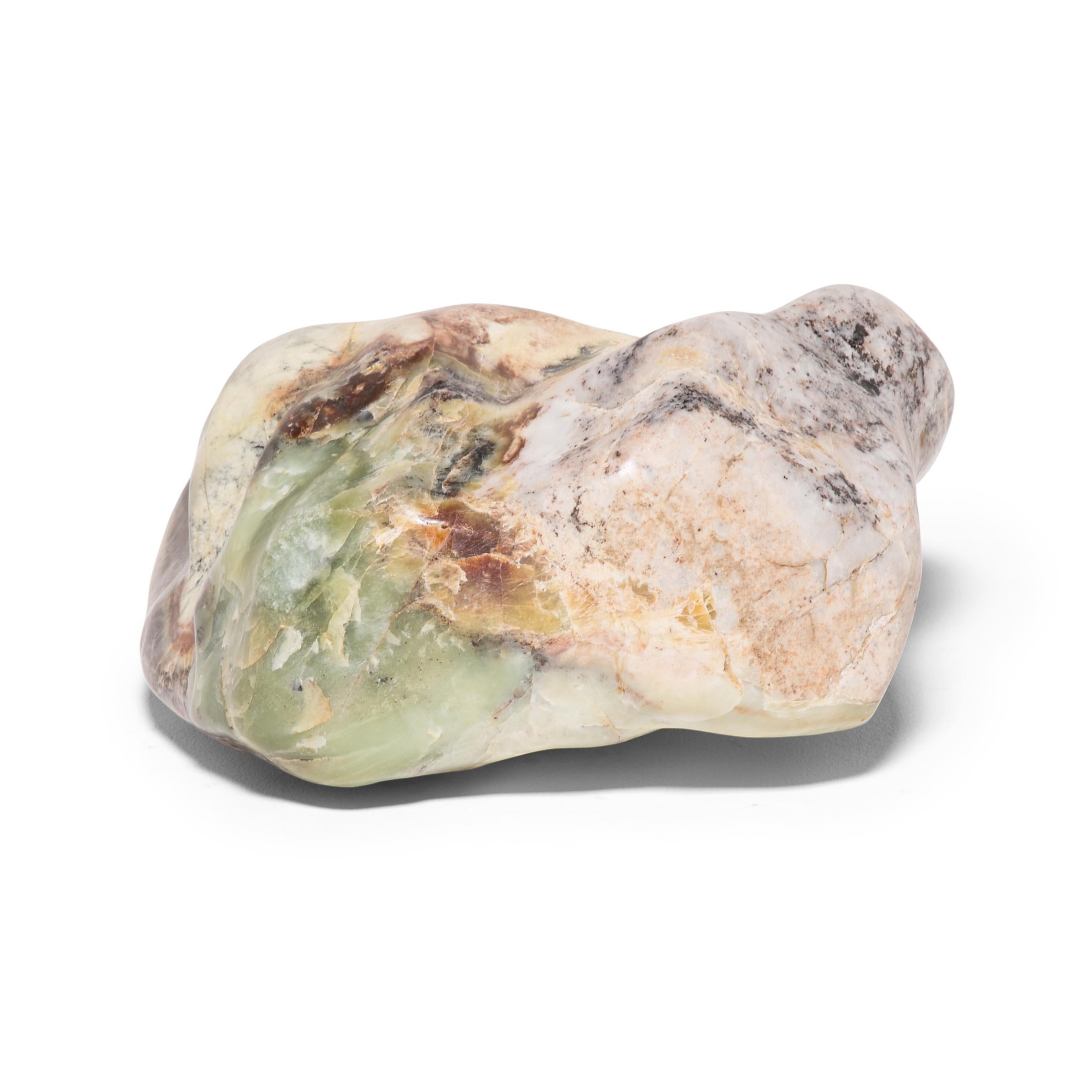 Following the softly sculpted form, green marbled coloring, and natural veins of this one-of-a-kind stone can be deeply meditative. Scholars in ancient China decorated their studios or gardens with stones like this beautiful Balin stone from Dongbei