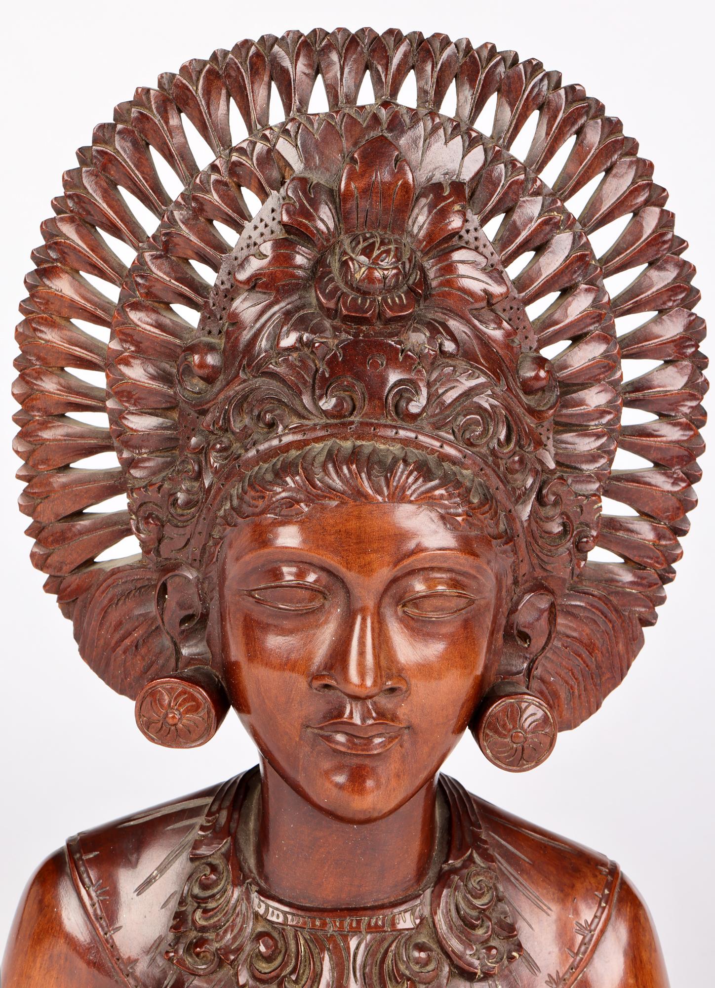 Hand-Carved Balinese Carved Wooden Portrait of a Girl in Headdress For Sale