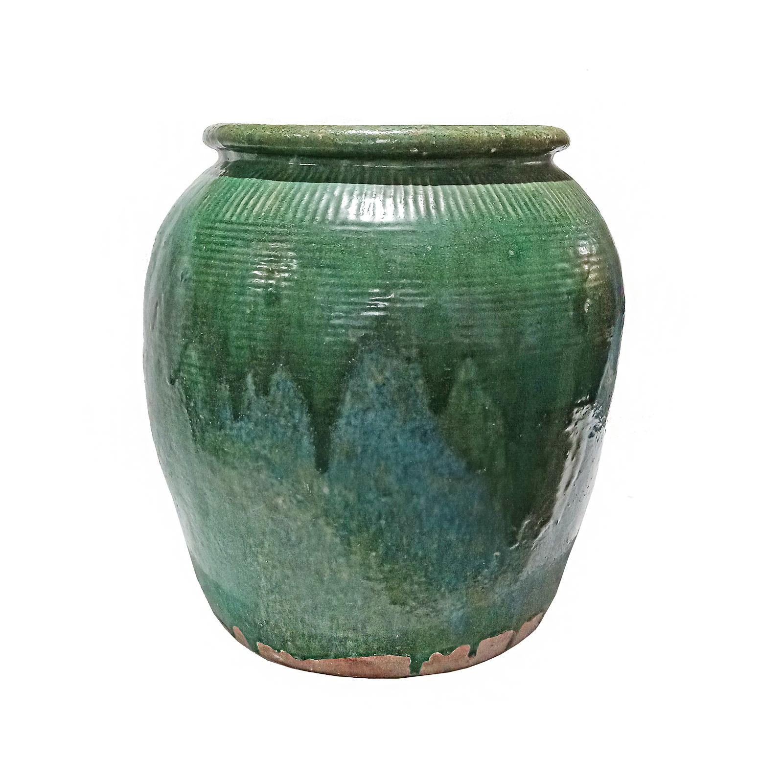 A large Terracotta jar / urn / planter from Bali, Indonesia, contemporary. 

Beautifully glazed in mottled green, resembling a watercolor with its different tones and shades throughout the piece. 

While the golden age of Thai ceramics ended around