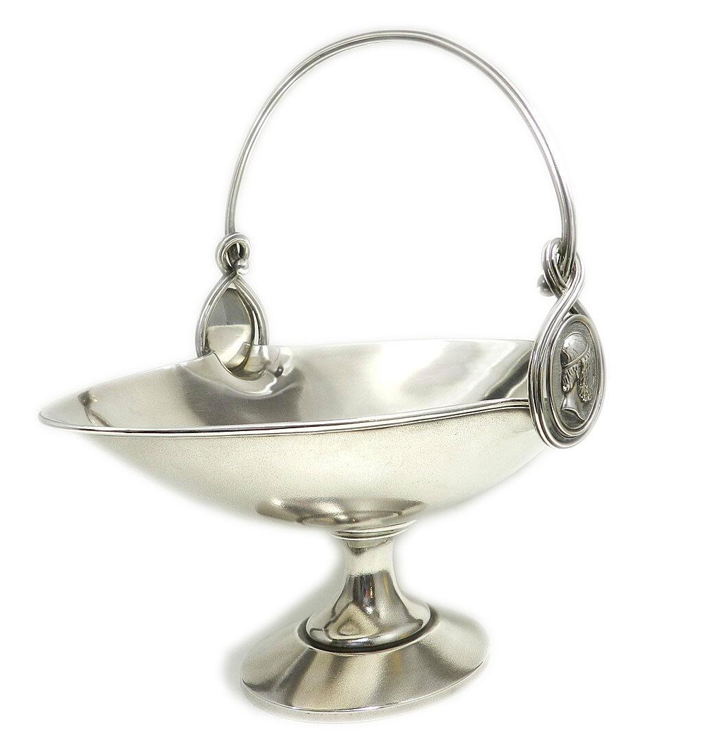 Ball Black & Co. Greek Revival Sterling Silver Basket circa 1870

Very decorative Greek style silver basket as a footed bowl in the Empire style on an oval stand with a narrow shaft, above it a boat-shaped body with a fixed overlapping handle and