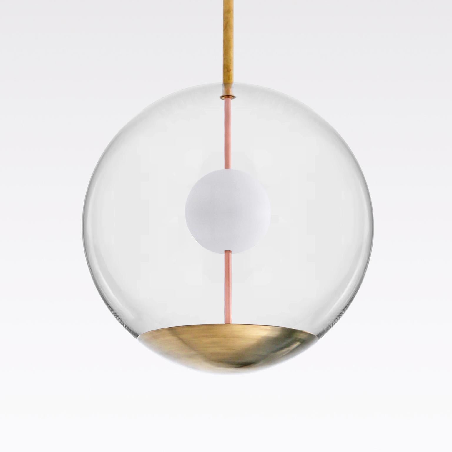 Custom-made ball ceiling light made of transparent glass, brass and opal glass.
For reflected light. Production time 8-10 weeks.