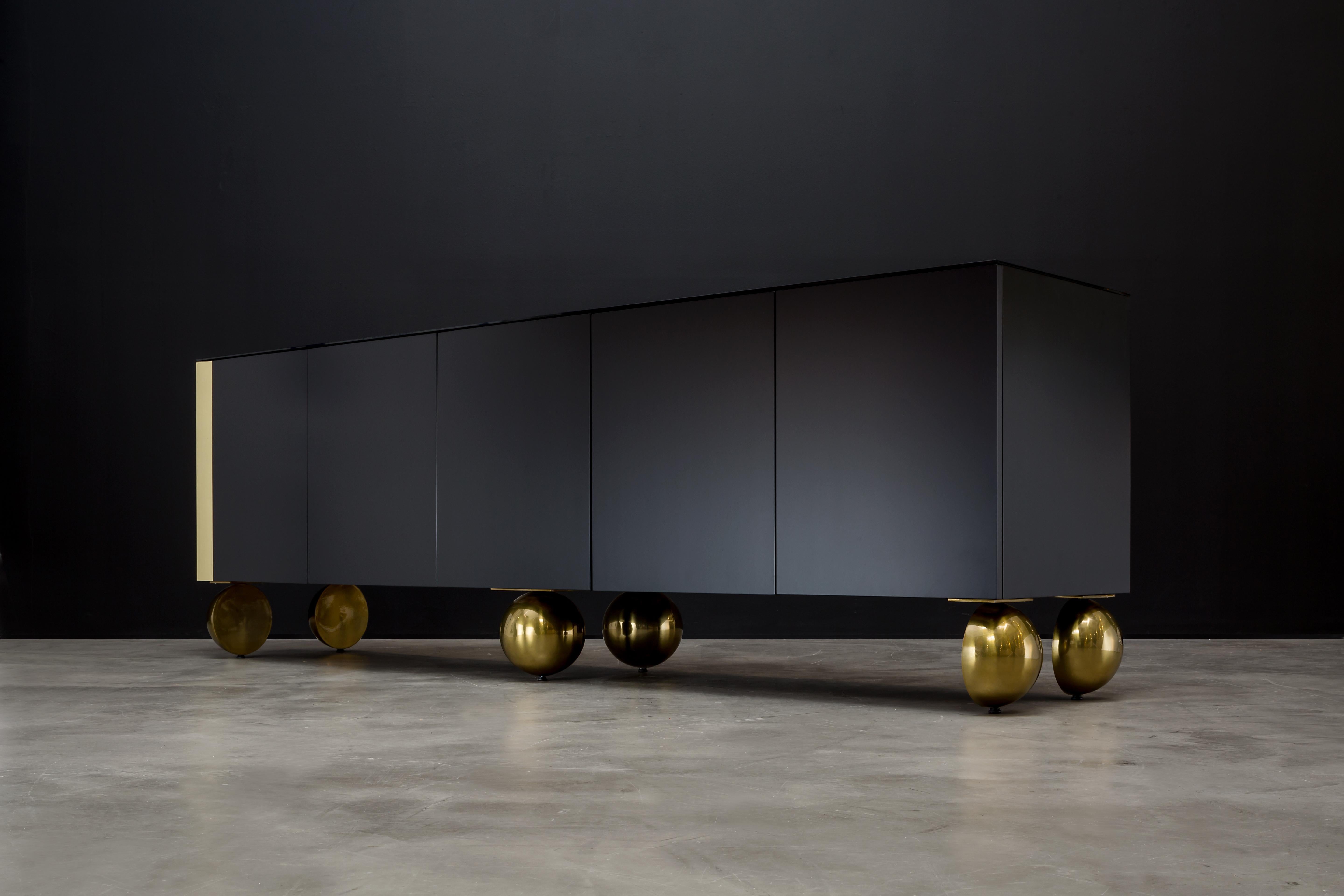 BALL CREDENZA XTRA - Modern Black Lacquer with Metal Inlay and Metallic Legs

Introducing the Ball Credenza Xtra, a stunning piece of modern furniture designed to elevate your living space. Handcrafted in California, this credenza boasts sleek lines