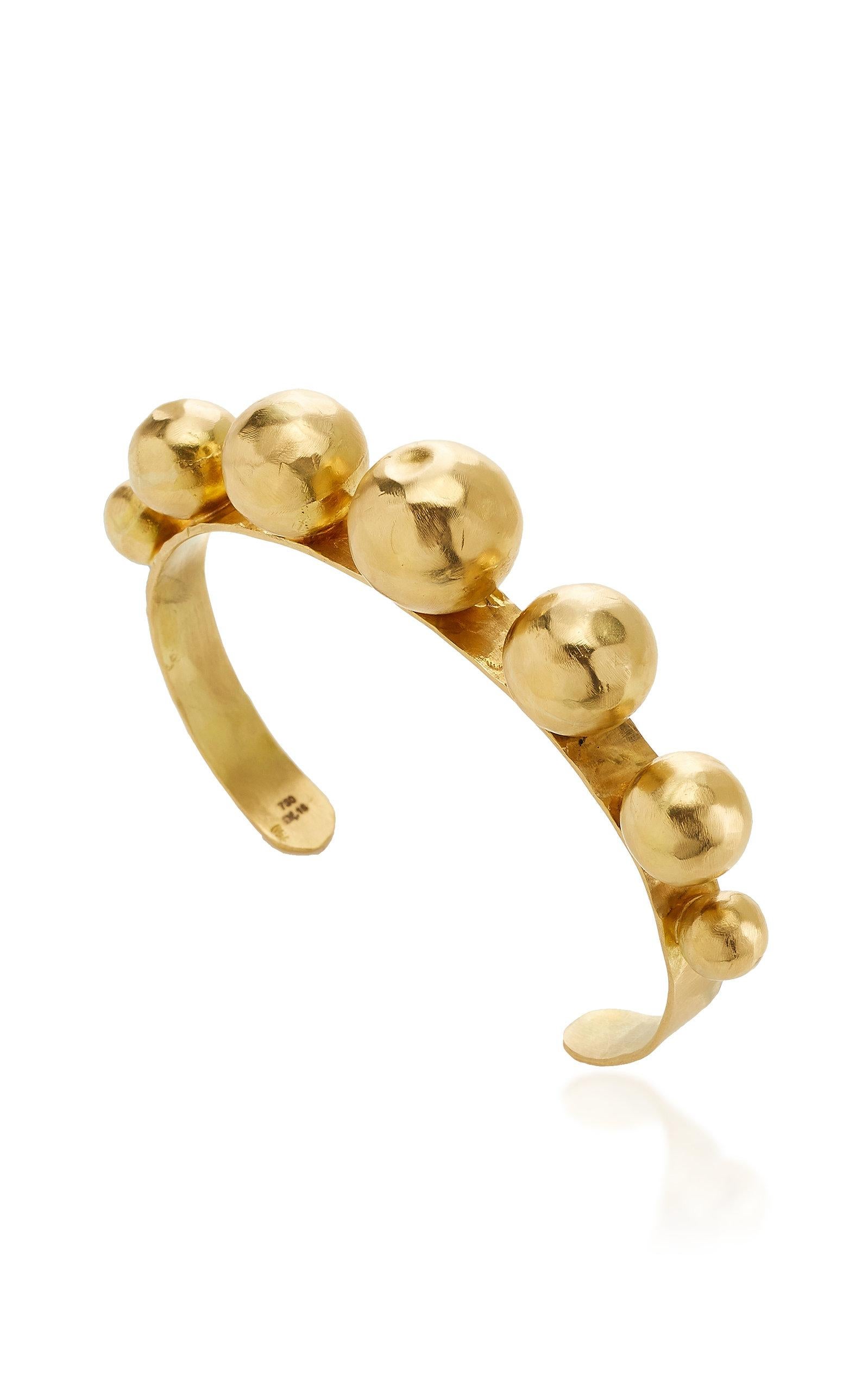 The Ball cuff bracelet is designed by Christina Alexiou.
This bracelet is crafted with 18k yellow gold. The balls are hollow, thus makes this piece an easy-to-wear  piece of jewelry. The Ball bracelet is available in yellow and pink 18k gold. 