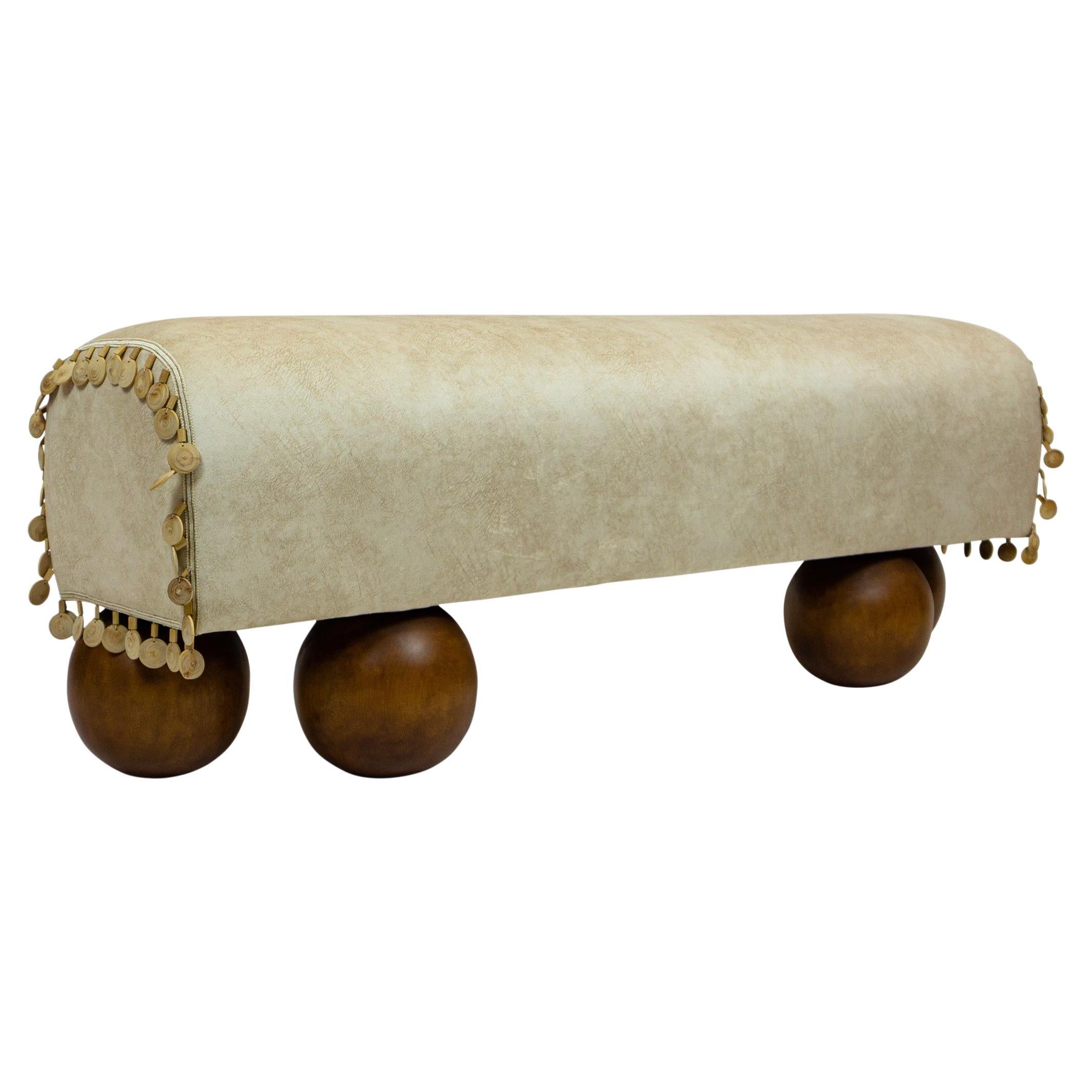 Modern, organic style bench with ball / sphere feet of solid maple. Saddle shaped seat and upholstered with eight-way hand-tied springs and high density foam. Upholstered with 