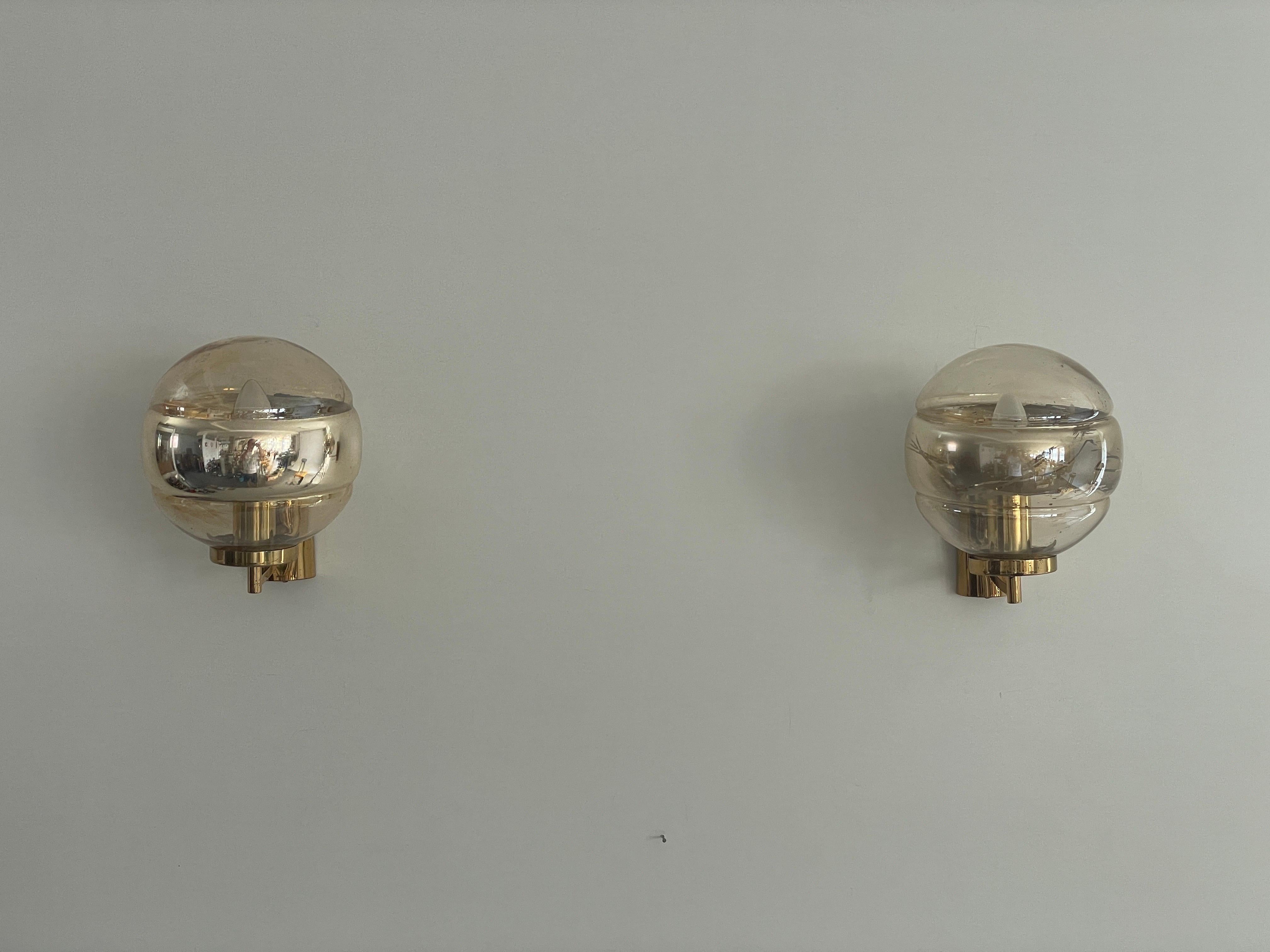 Ball Glass and Brass Body Pair of Sconces by Peill und Putzler, 1960s, Germany

Very elegant and Minimalist wall lamps

Lamps are in very good condition.
Note: There are some missing paints on the gilded inner of a lamp. It happened while the lamp