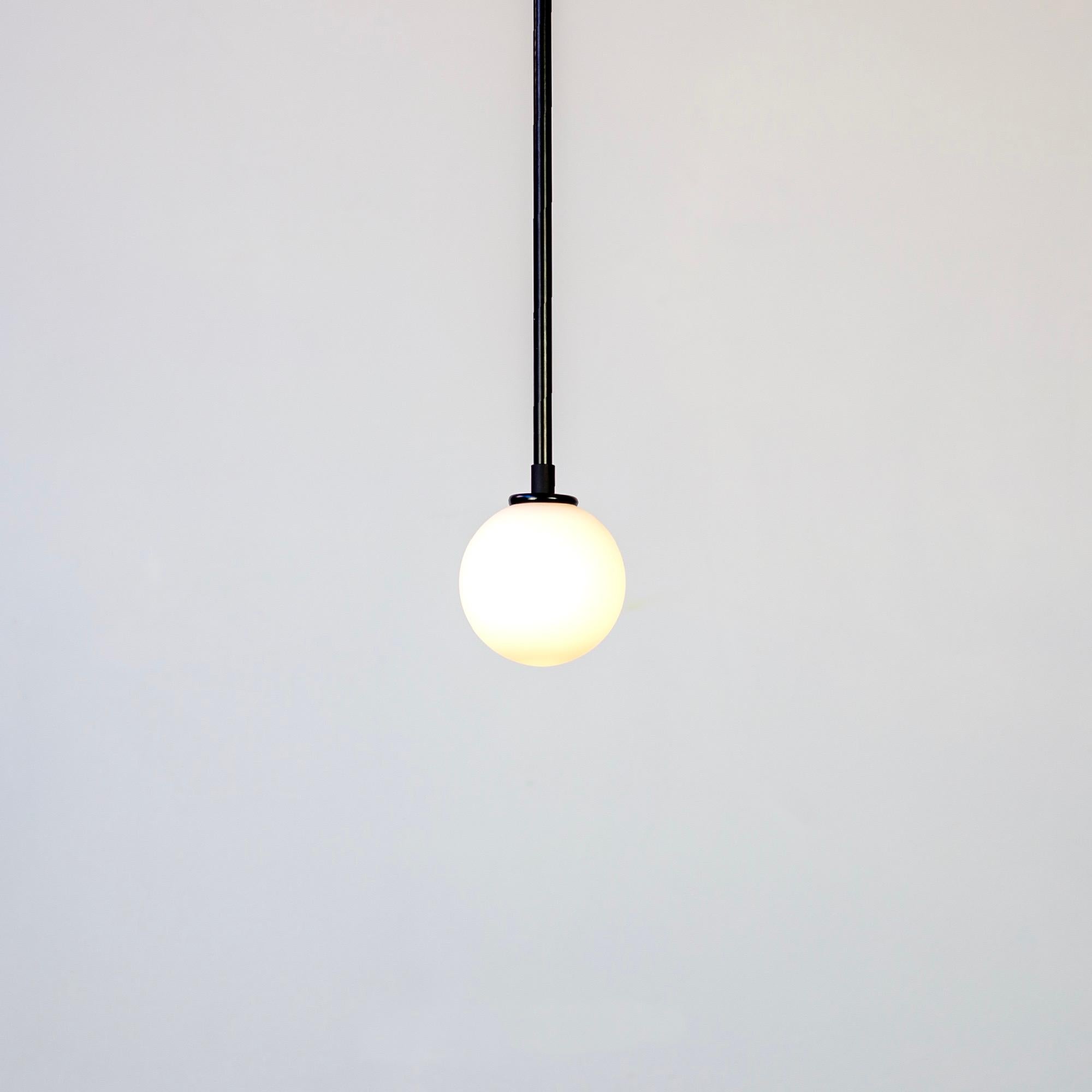 This listing is for 1x Ball Pendant in Black designed and manufactured by RESEARCH Lighting.

Materials: Steel & Glass
Finish: Powder Coated Steel in black
Electronics: 1x G9 Socket, 4.5 Watt LED Bulb (included), 450 Lumens
Suspension: 5