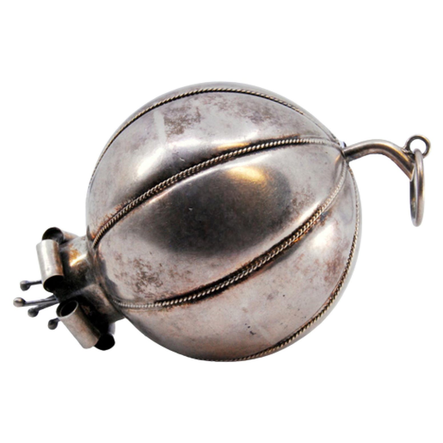 Ball-shaped silver curtain handles with flower-like appliqués