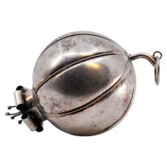 Ball-shaped silver curtain handles with flower-like appliqués