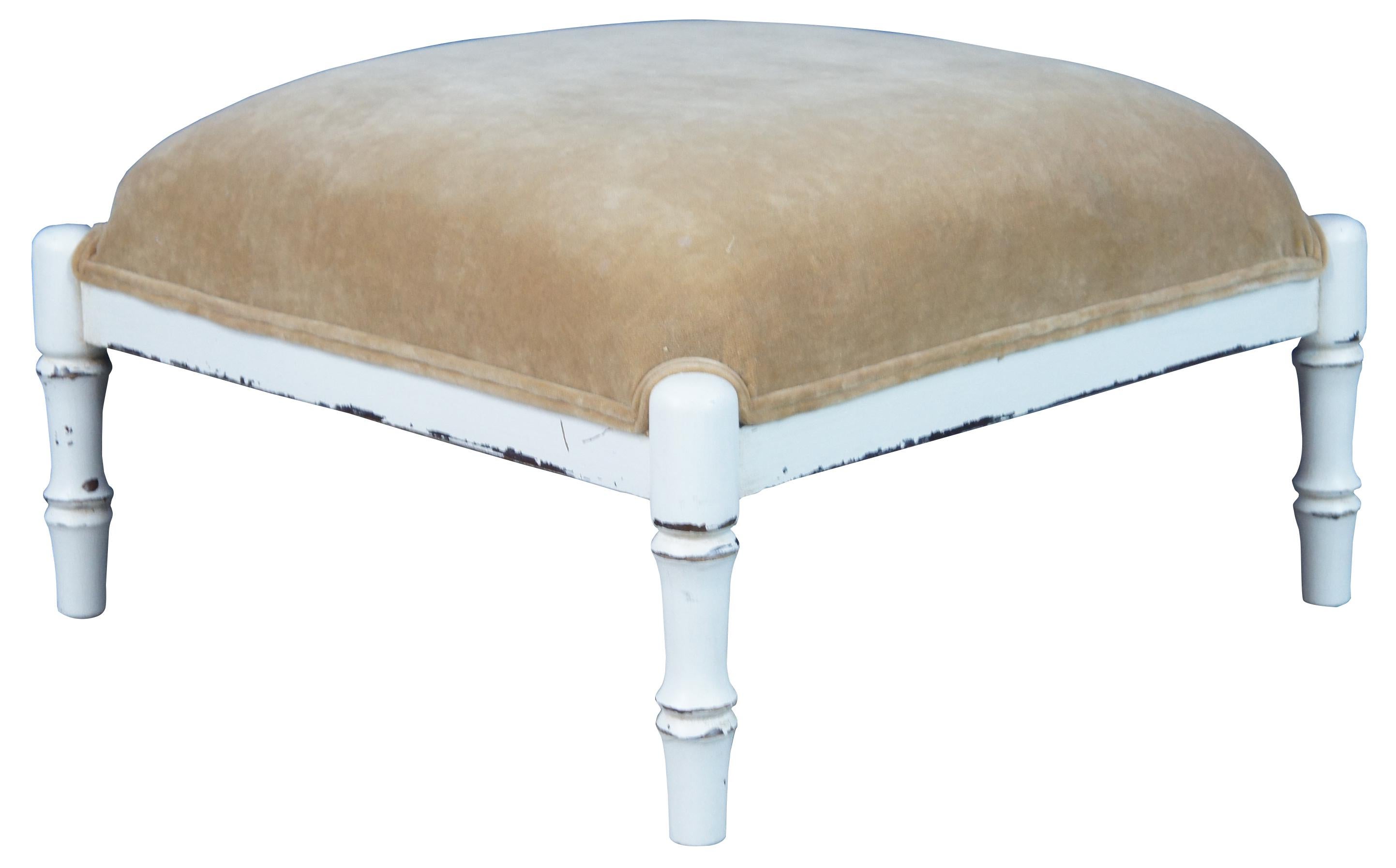 Vintage Ballard designs square form ottoman or foot stool. Features a white distressed finish allowing the natural understones of the wood to be seen trhogh. Features turned legs and beige fabric with double cording.
    