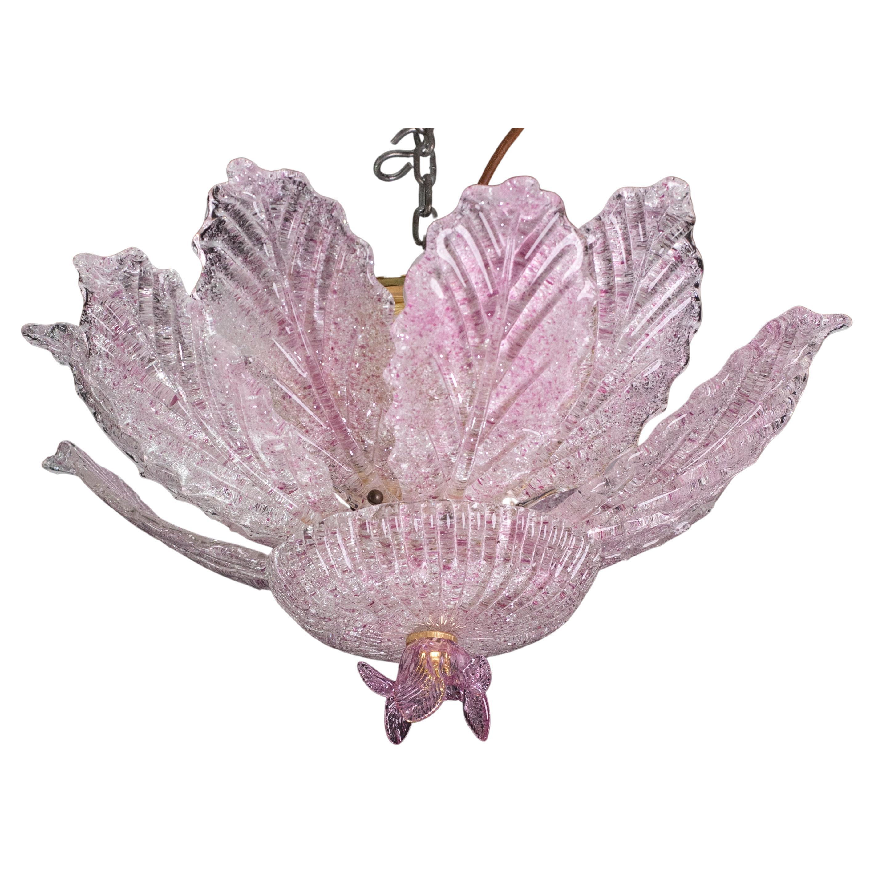 Splendid Murano pink glass ceiling lamp.

Period: circa 1970.

The light mounts 6 standard European e14 lamp holders, possible to switch for Usa standards

Height measures 30 centimeters from the ceiling, diameter about 50 centimeters.