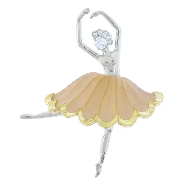 A graceful Ballerina strikes an Arabesque positions.  Painstakingly created from the original 1950s models in 18-karat white, yellow and rose gold by Pampillonia Jewelers. The brooch features a center oval diamond weighing .36 carats and five