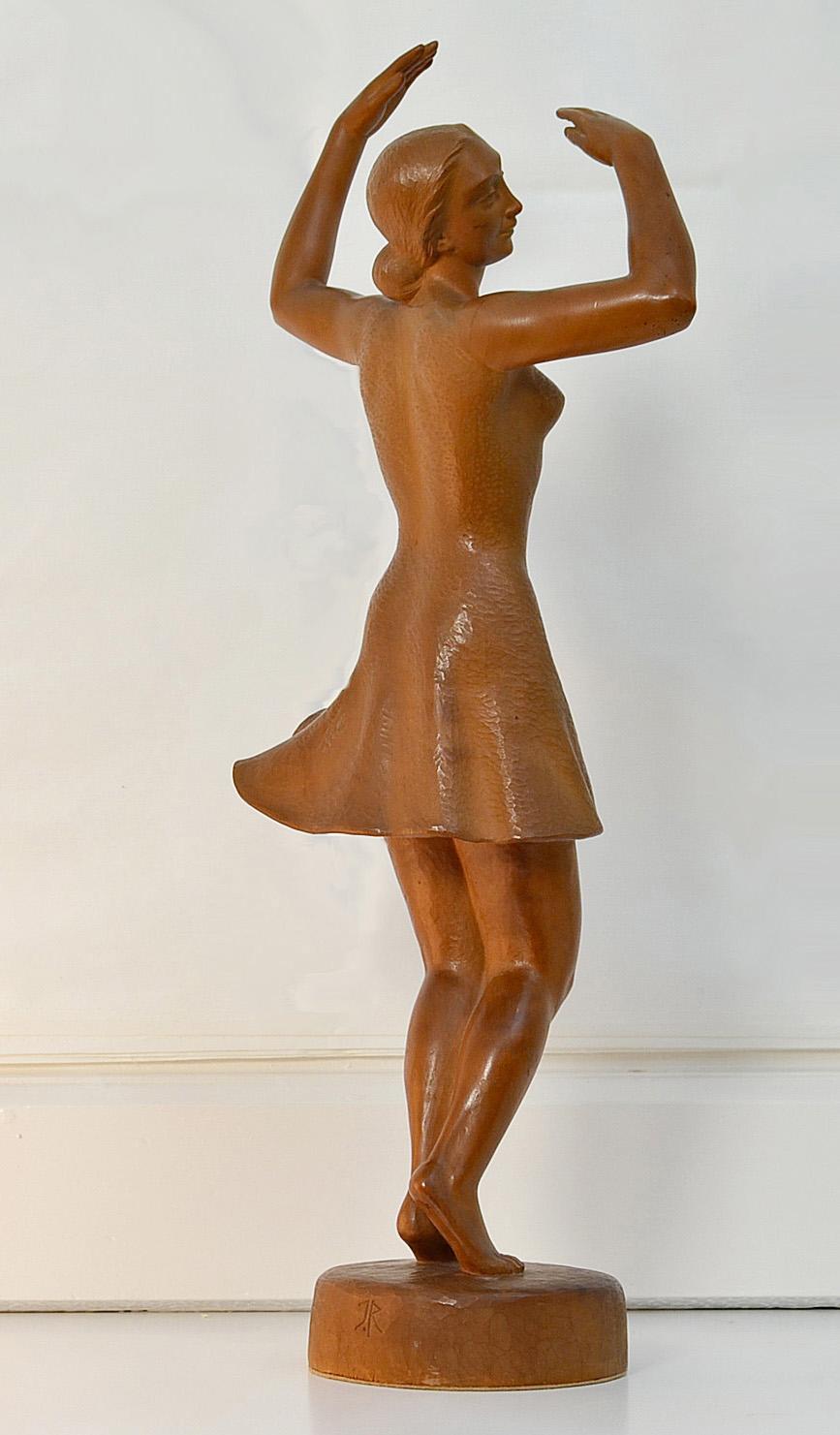 Female Dancer sculpture carved Wood by the German sculptor Jakob Rudolph, born 1887 in Munich.
Graceful light brown Ballerina Height 50 cm. 
Monogrammed J.R and Signed Rudolph 1942.