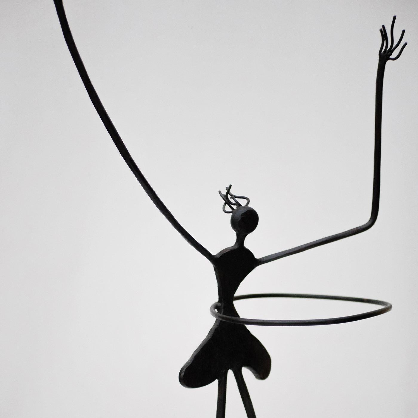 This delightful sculpture deftly handcrafted from wrought iron proves that grace is not a synonym for perfection. Harmony can be found in disproportionate volumes if part of a thoughtful picture, as in this enchanting female dancer (