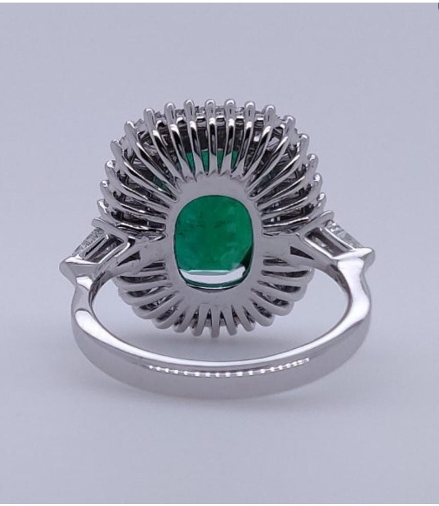 Oval Cut Ballerina Style 4.32 Carat Natural Emerald and Diamonds Engagement Ring For Sale