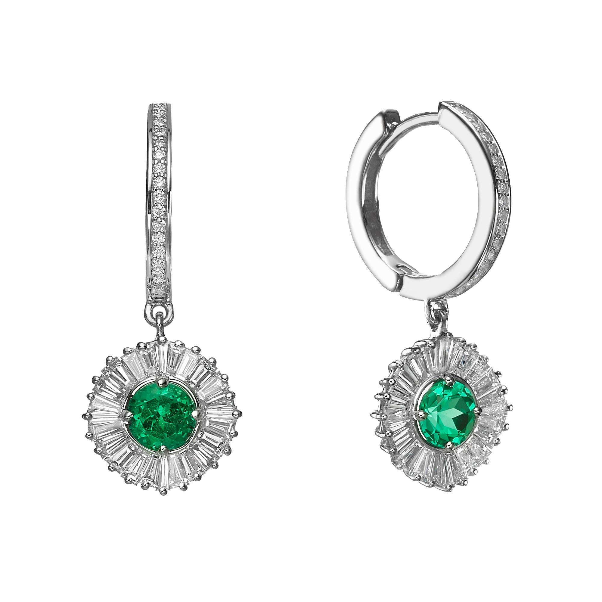 One of a Kind Ballerina Style Emerald and diamonds Earrings starring 2 natural emeralds 1.2 Carats and surrounded by 48 Baguette cut diamonds and 34 round diamonds. 
Jewel Details: 
Center-
2  Natural Emeralds, Round Brilliant cut
1.2 Carat Total