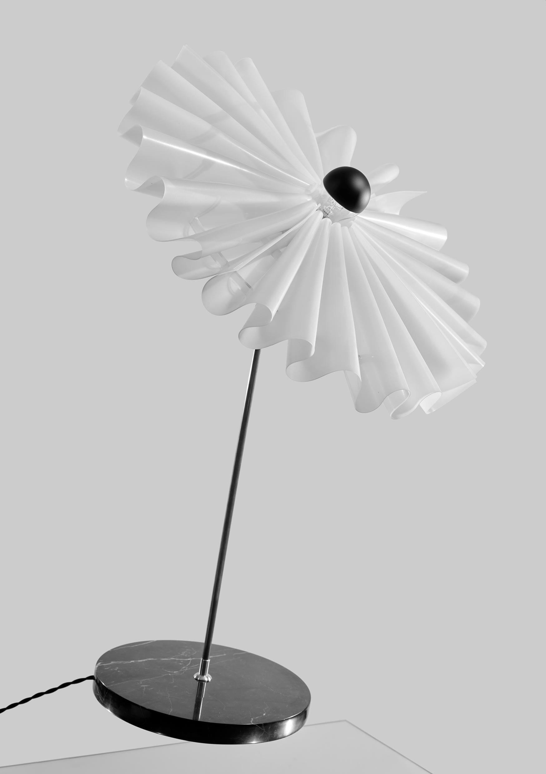 The Ballerina table lamp by Elise Luttik
Dimensions: D 53 x H 50 cm
Materials: Silicon translucent tutu, brass, marble base.
Available in 2 sizes: H 40, H 50 cm.

Elise Luttik materialises the illusion of ballet on your table. The Ballerina, a table