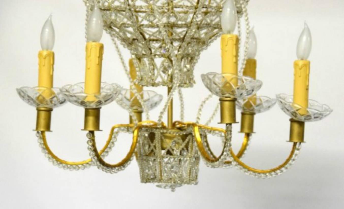 Hot air balloon form chandelier.  Gilded metal effect frame with 6 lighted arms and a crystal bead decoration.