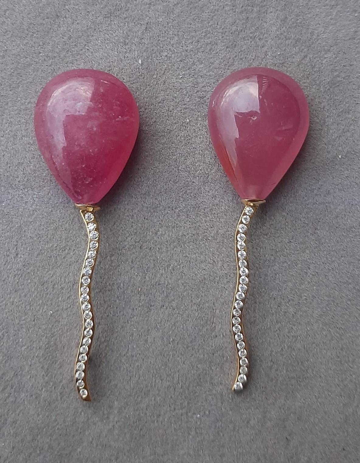 2 pear-shaped Natural Ruby pear shape cabs measuring 15x20 mm. mounted like balloons with the thread holding them made of 14 carat White Gold and 44 small diamonds.

In 1978 our workshop started in Italy to make simple-chic Art Deco style jewellery,