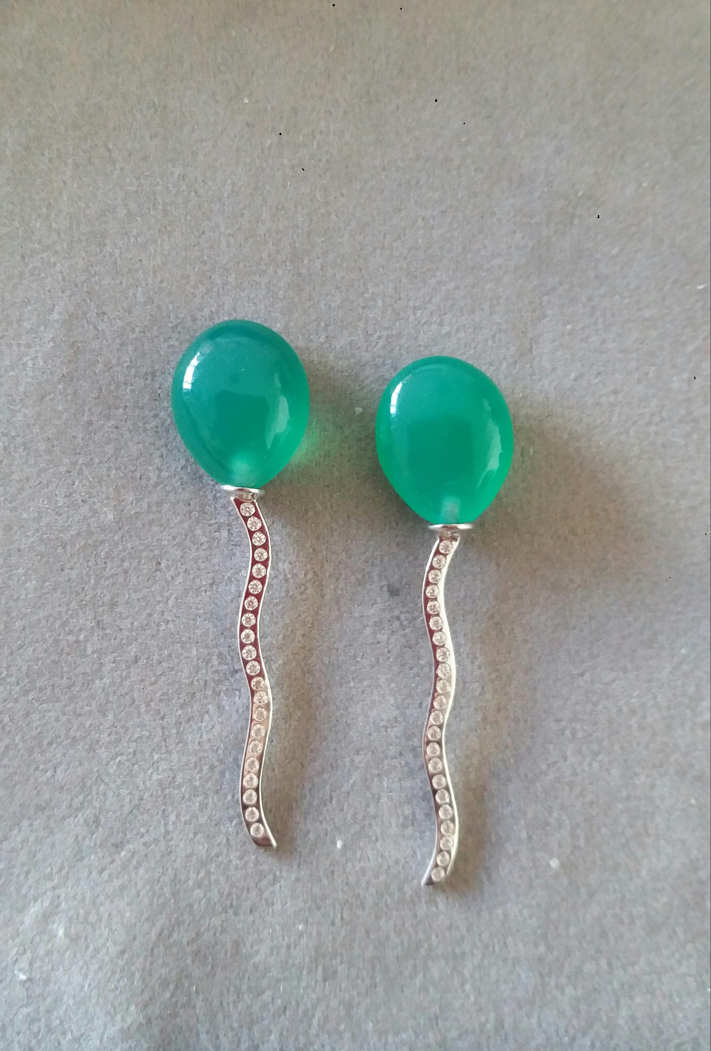 2 pear-shaped Natural Color Green Onyx cabs measuring 11x15 mm.mounted like balloons with the thread holding them made of 14 carat White Gold and 44 small diamonds.

In 1978 our workshop started in Italy to make simple-chic Art Deco style jewellery,