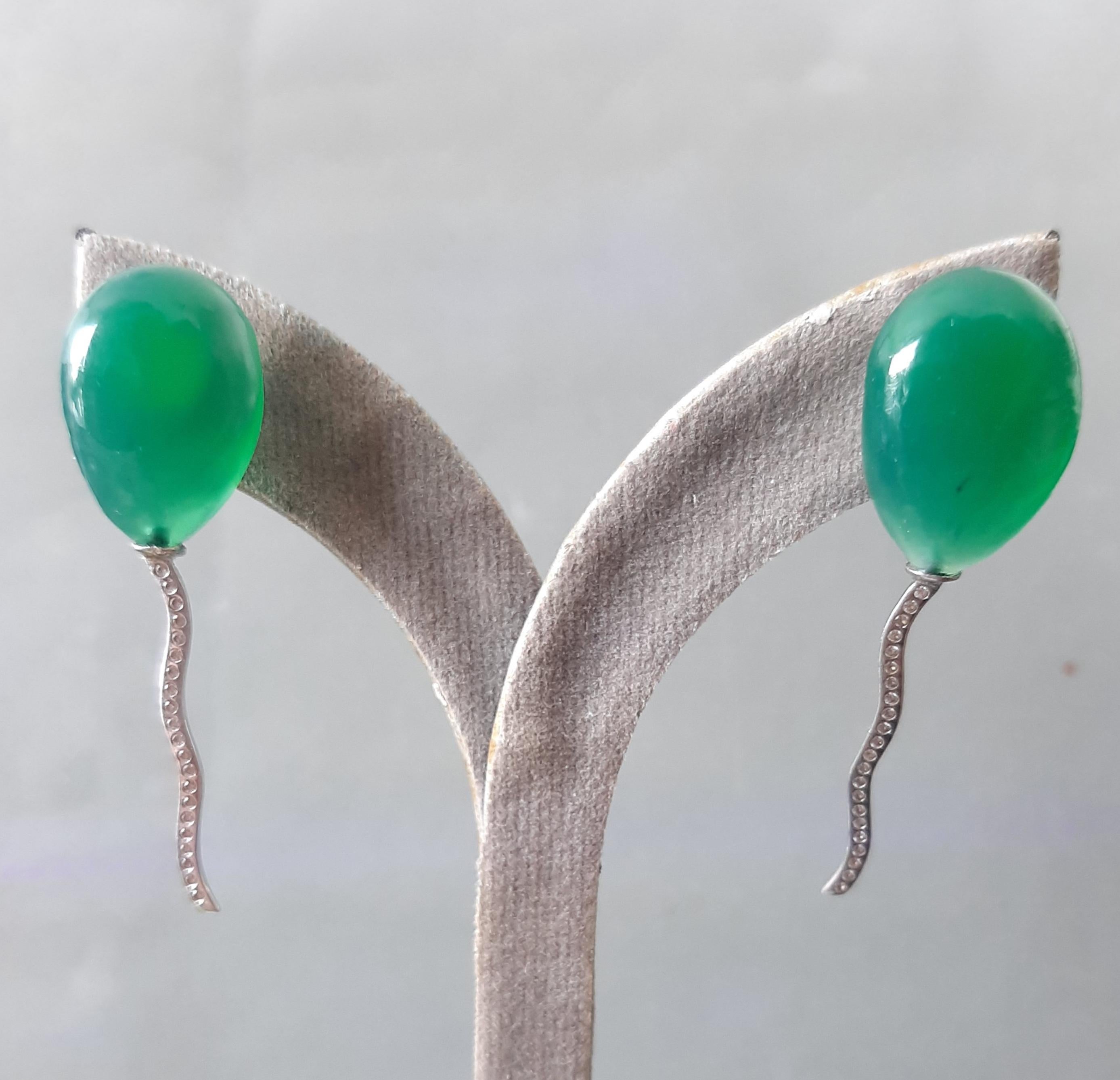 2 pear-shaped Natural Color Green Onyx cabs measuring 20x15 mm.mounted like balloons with the thread holding them made of 14 carat White Gold and 42 small diamonds.

In 1978 our workshop started in Italy to make simple-chic Art Deco style jewellery,