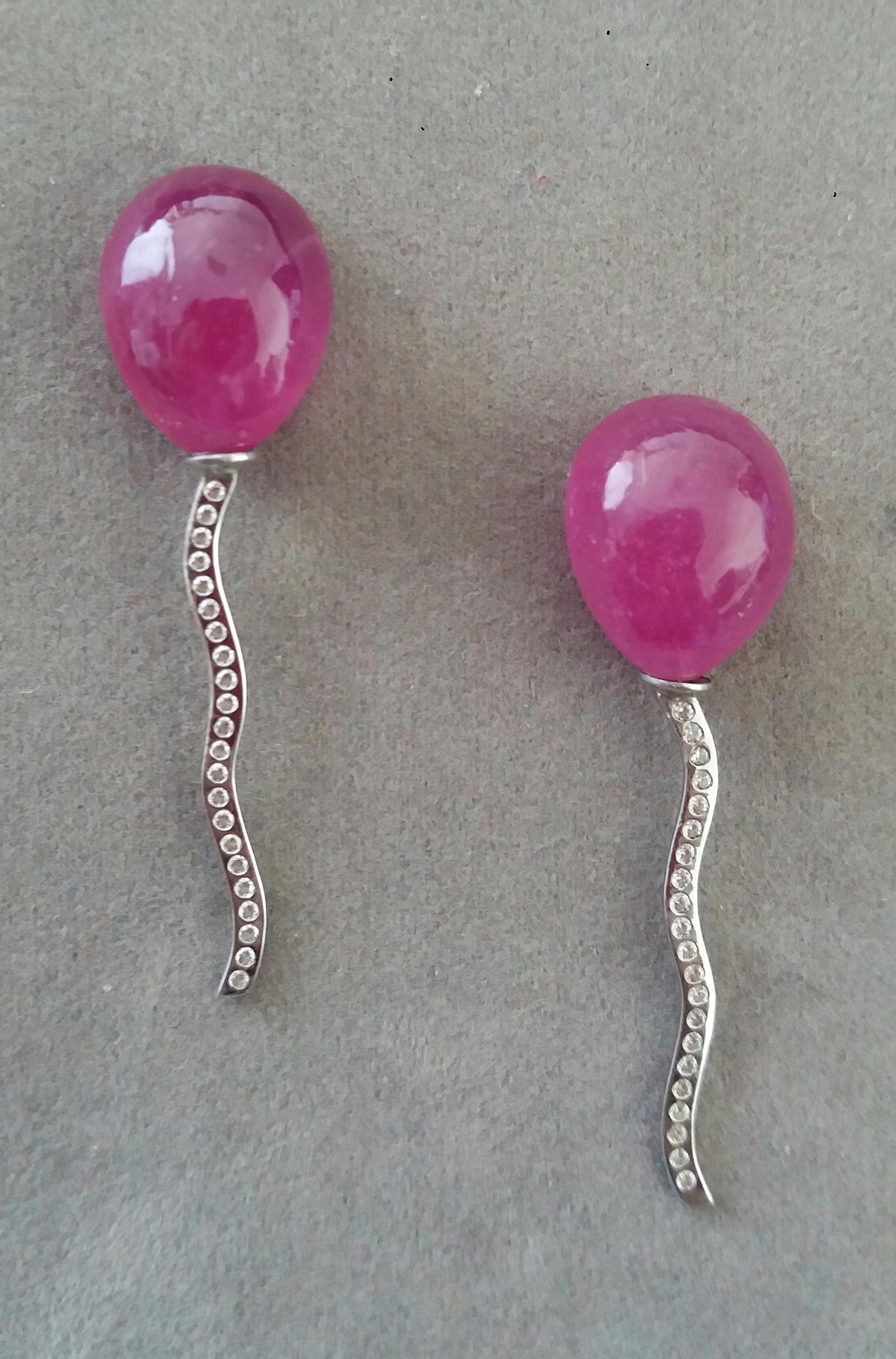2 pear-shaped Natural Ruby pear shape cabs measuring 12x16 mm. mounted like balloons with the thread holding them made of 14 carat White Gold and 44 small diamonds.

In 1978 our workshop started in Italy to make simple-chic Art Deco style jewellery,