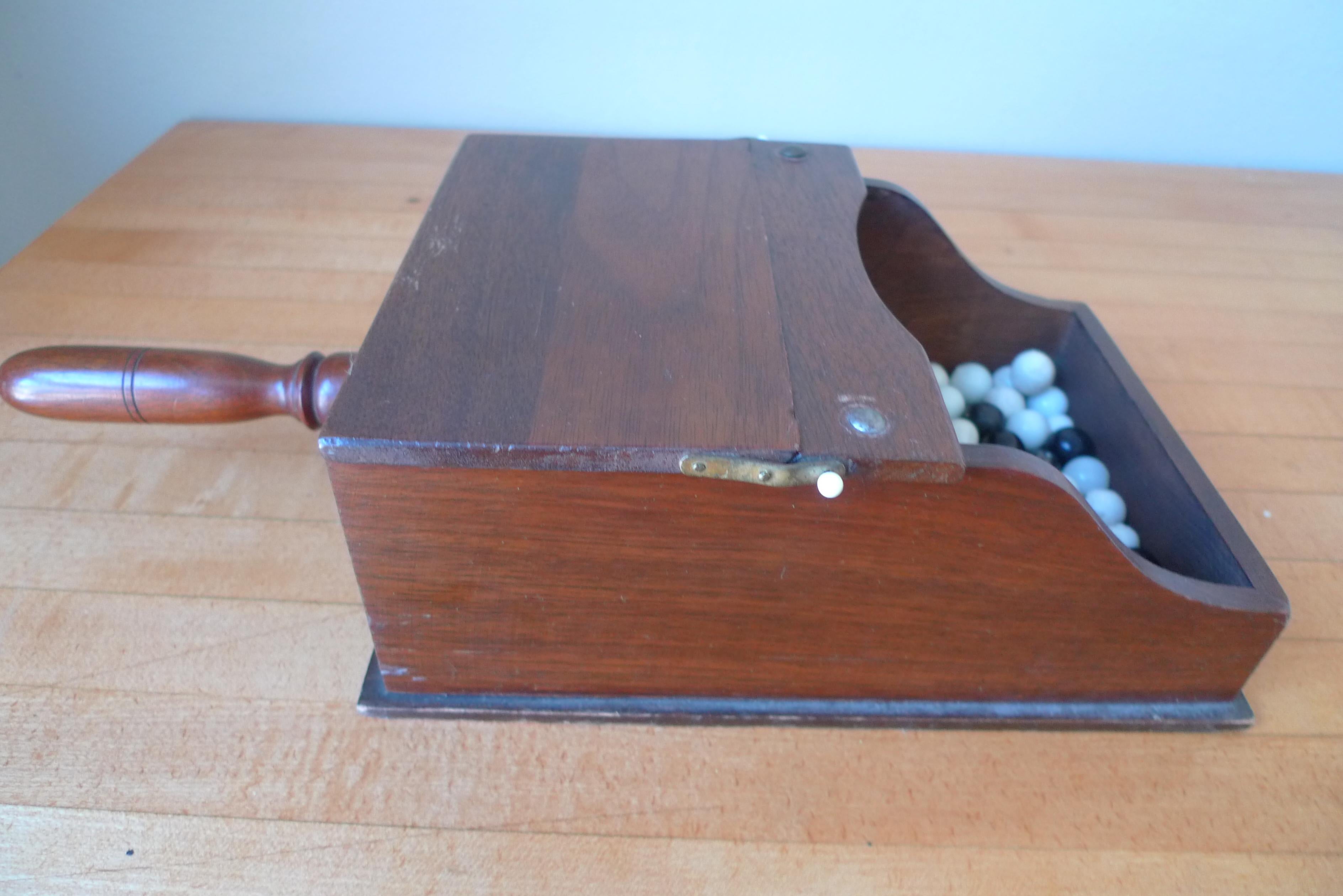 Arts and Crafts Ballot Box with Black and White Glass Balls in Handheld Lidded Walnut Box For Sale