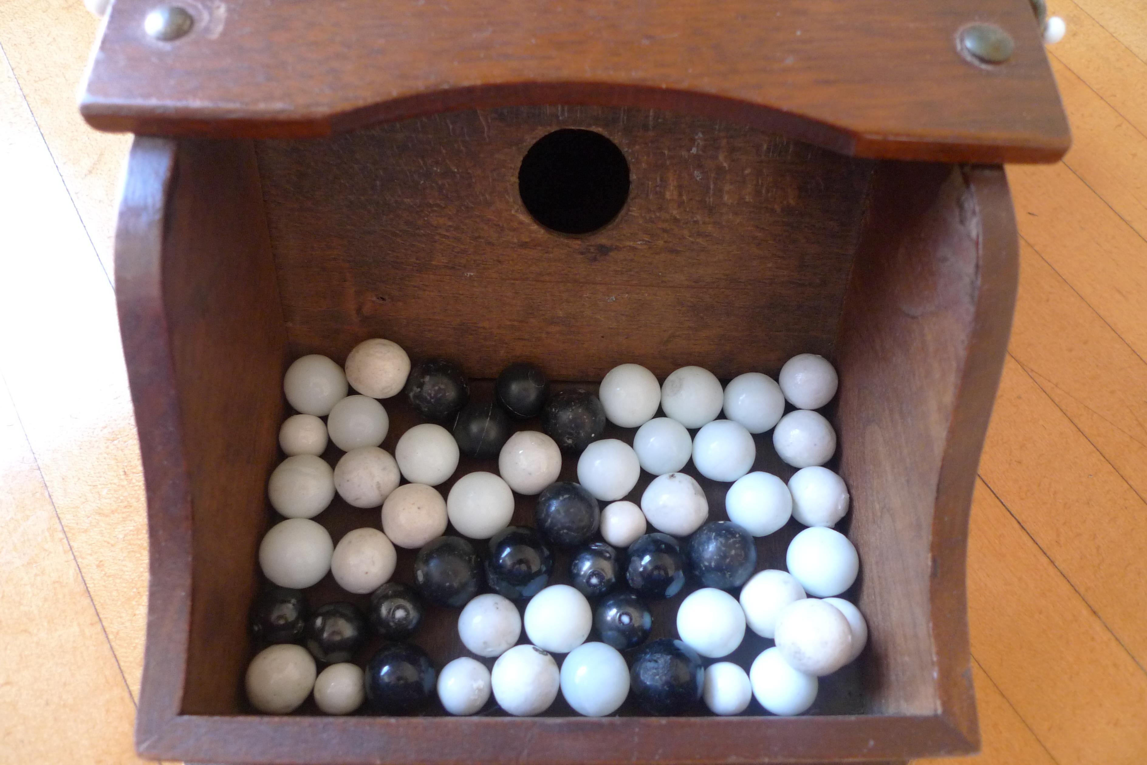 American Ballot Box with Black and White Glass Balls in Handheld Lidded Walnut Box For Sale