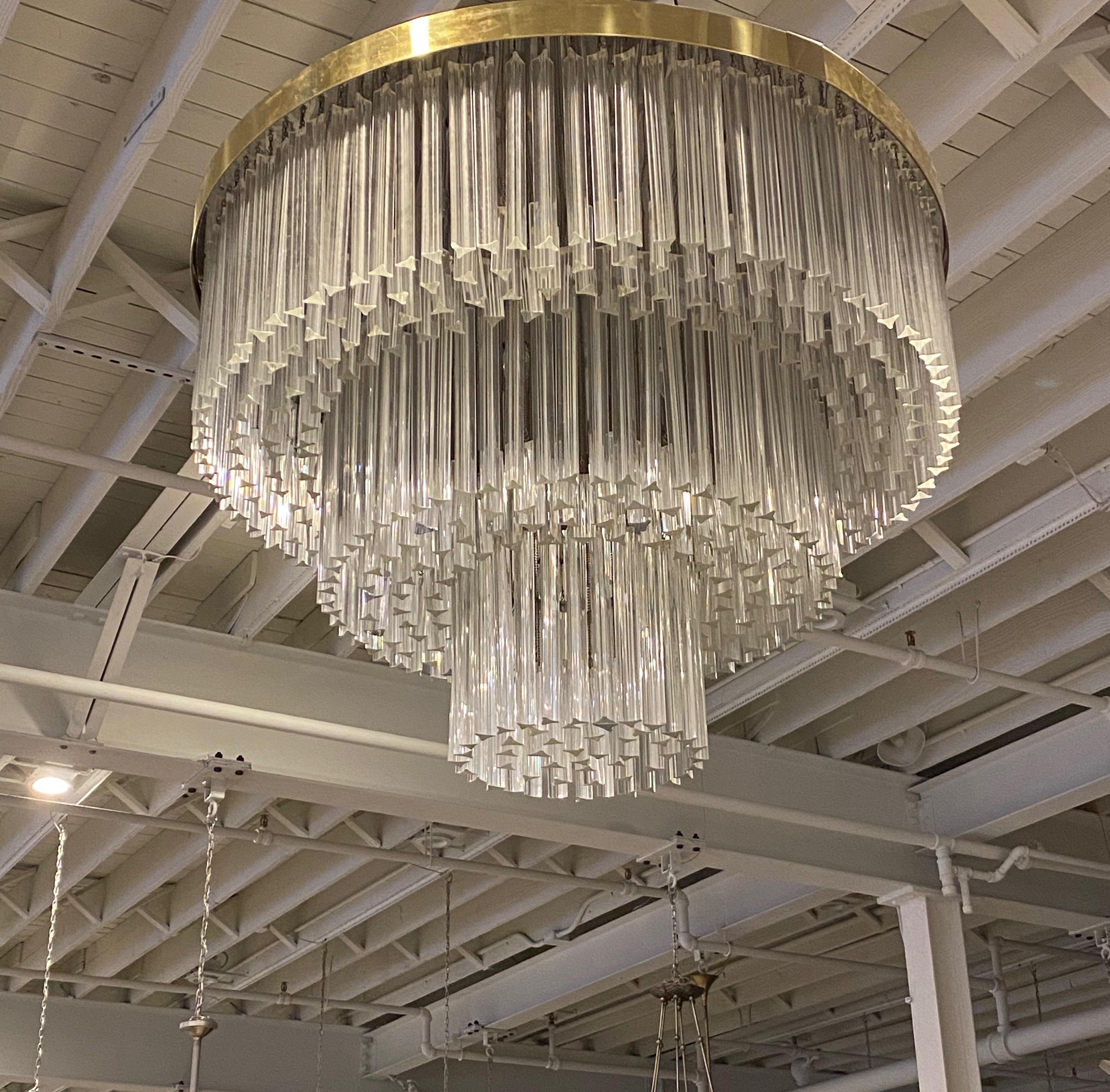 Stunning Mid-Century Modern round flush mount chandelier. Each of the prisms are solid glass, measuring 12 and 4 inches. They hang from hooks on a nickel (silver) frame, as pictured. Has been rewired for American use with 20 medium base sockets.