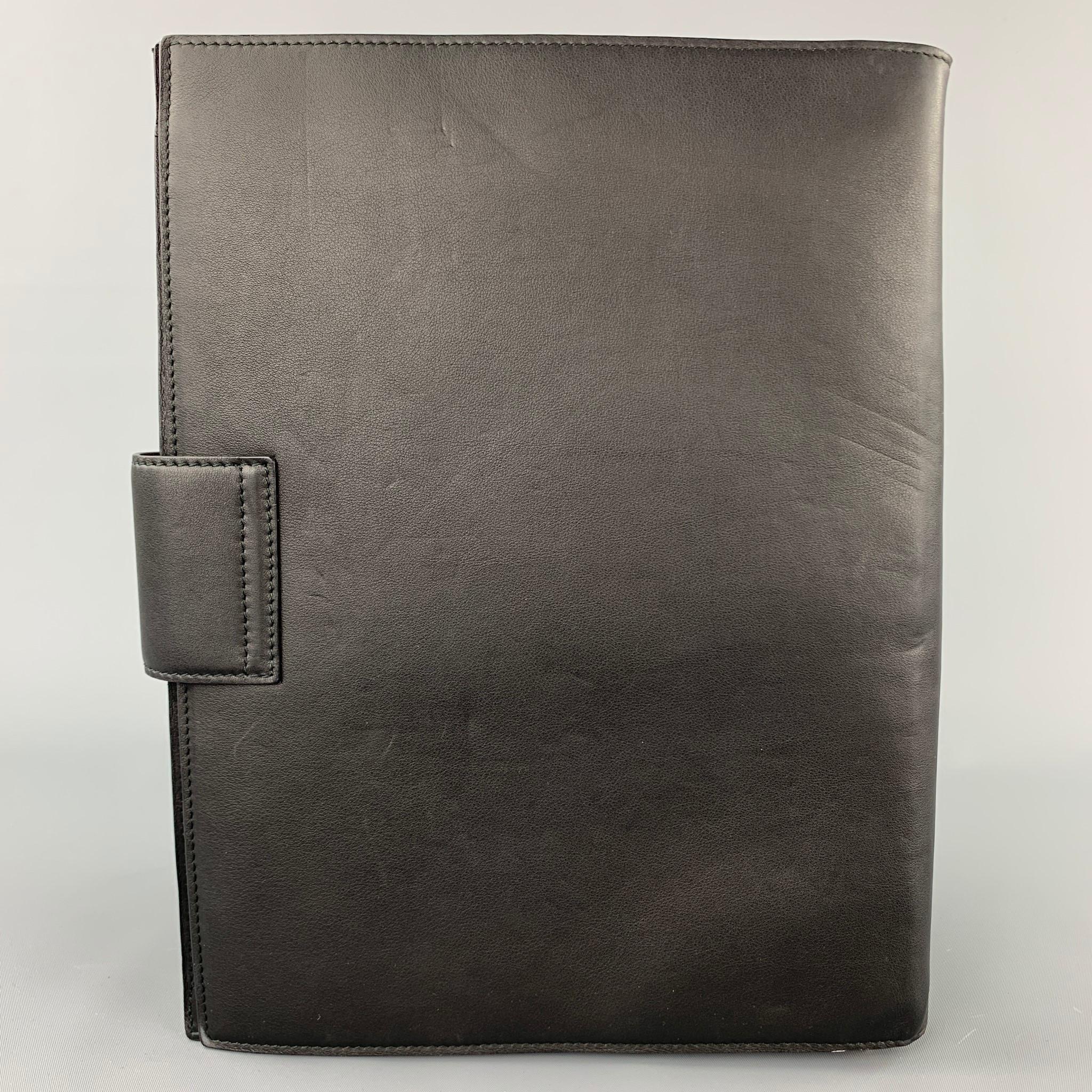 BALLY A/W 11 briefcase comes in a black leather featuring a removable shoulder strap, inner slots, and a push on closure. 

Very Good Pre-Owned Condition.
Original Retail Price: $670.00

Measurements:

Length: 9.5 in.
Height: 12 in.
Drop: 22 in. 