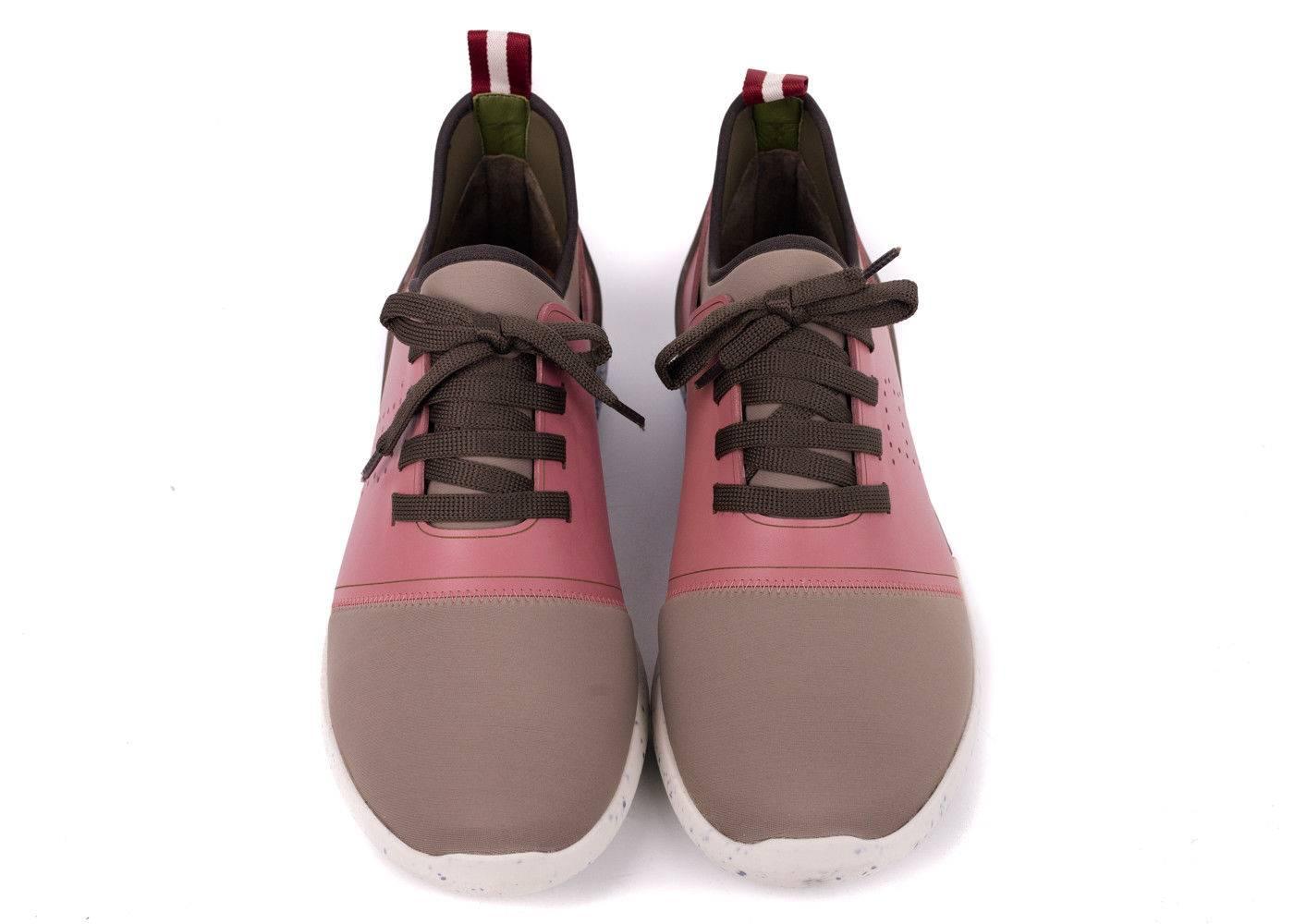 Bally's Avelle sneakers in a light brown and pink color tone with water marked designs on the outer sole. These sneakers are the perfect pair to have for this incoming spring summer season. Pair it with your favorite denim jeans and top for a laid