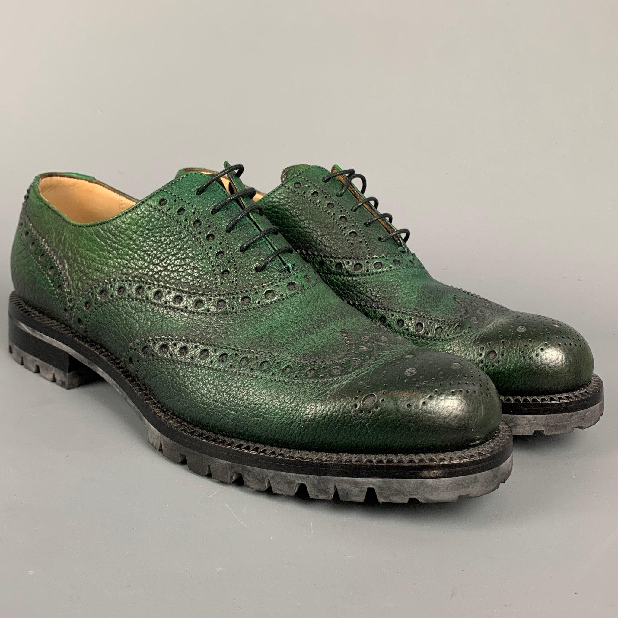BALLY shoes comes in a green perforated leather featuring a wingtip, lace up, and a track sole. Made in Italy. Very Good
 Pre-Owned Condition. 
 

 Marked:  EU 9 E US 10 D NTKD Outsole: 12 inches x 4 inches 
  
  
  
 Sui Generis Reference: 110221

