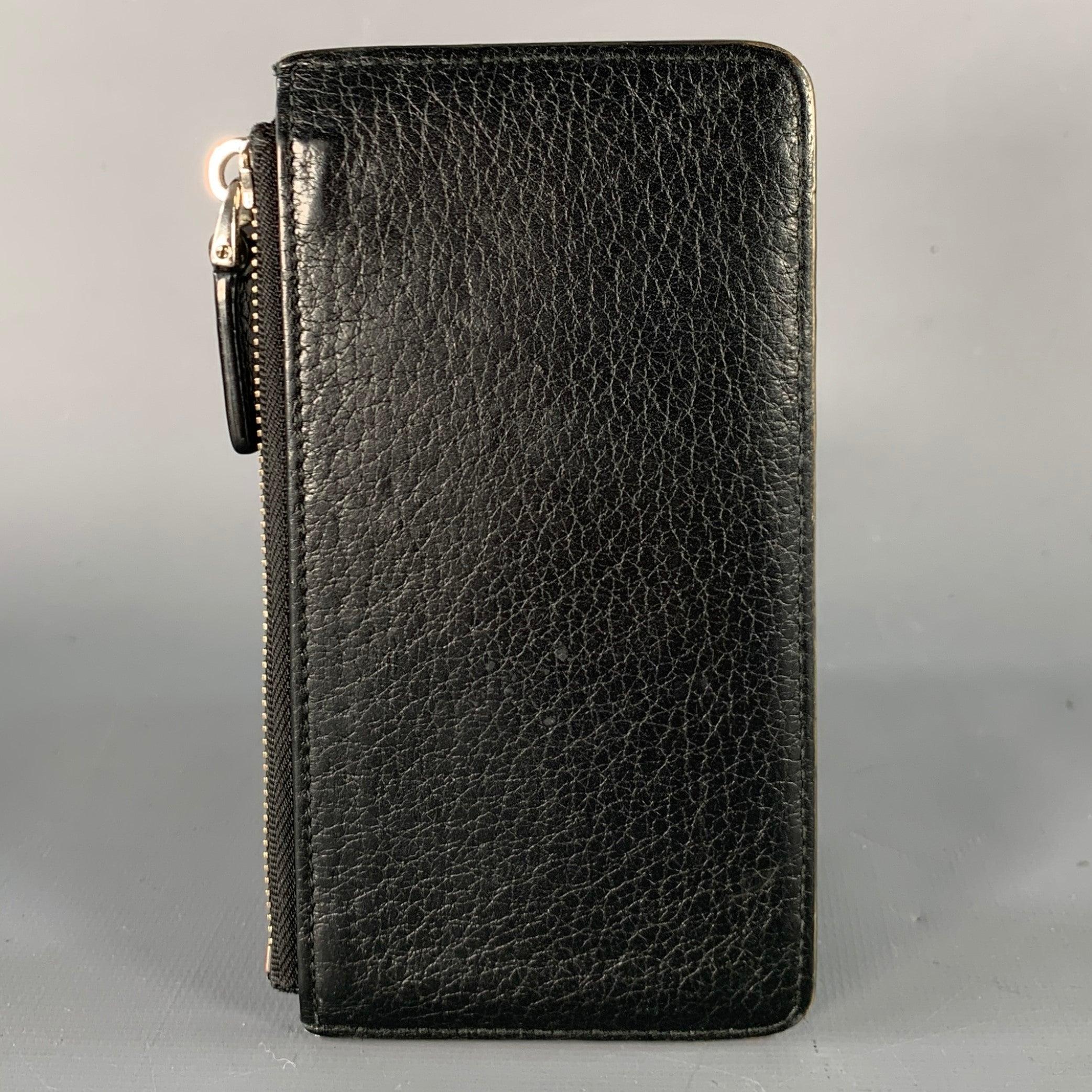 BALLY wallet
in a black leather featuring multiple card slots and coin purse with zip closure.Excellent Pre-Owned Condition.5.5 X 2.75 inches 
  
  
 
Sui Generis Reference: 137850
Category: Wallet
More Details
    
Brand:  BALLY
Color: 