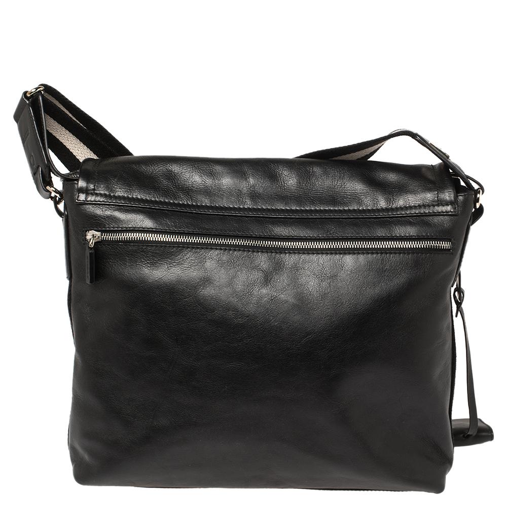 This easy-to-carry Bally messenger bag can be paraded from workday to the weekend. It has a smart and practical design. The bag is crafted using leather, lined with fabric, and held by a striped shoulder strap.

Includes: Info Booklet